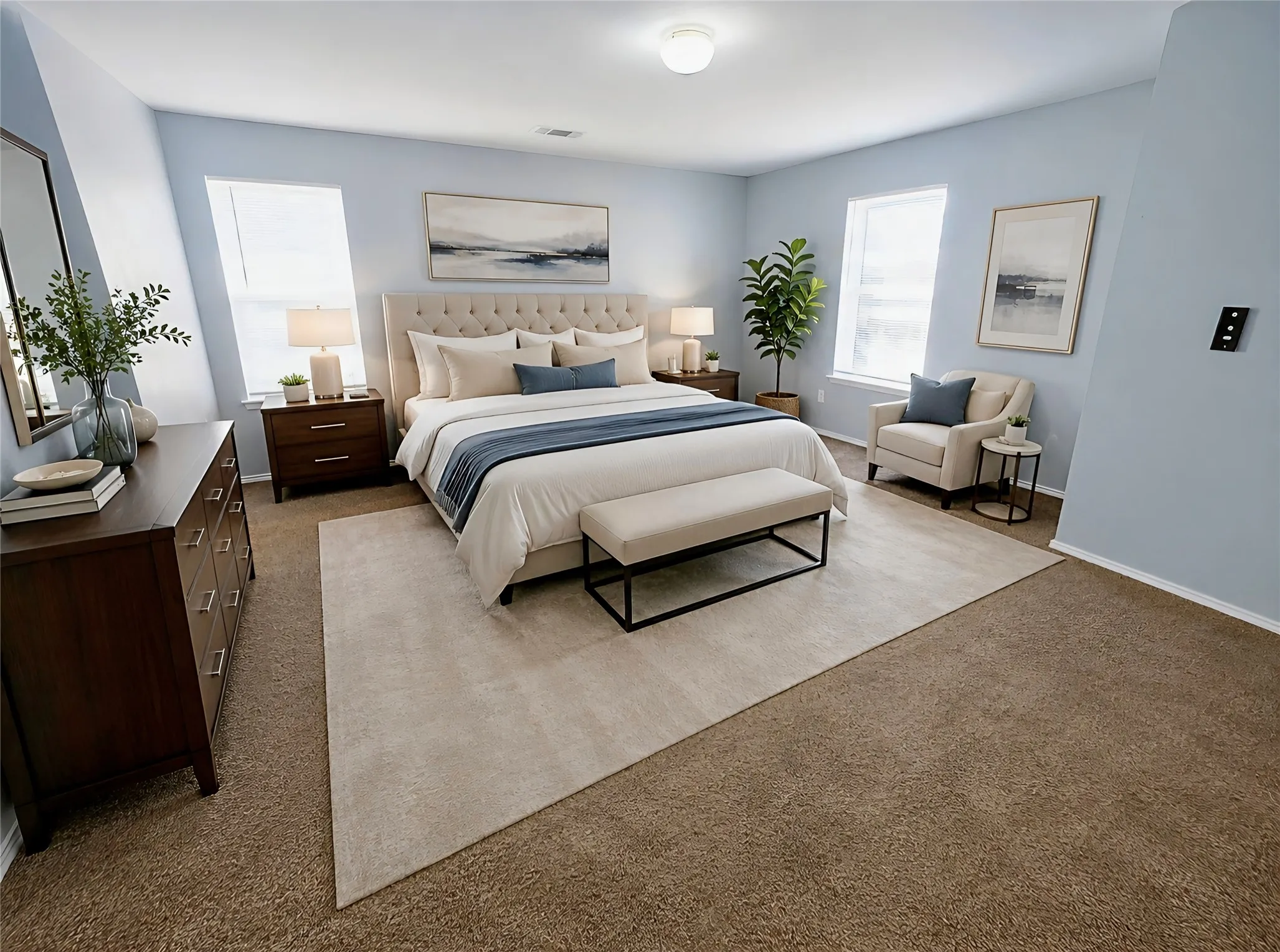 Spacious master bedroom with new carpet, double French-door entry, light neutral walls, multiple windows for abundant natural light, and generous dual walk-in closet spaces.