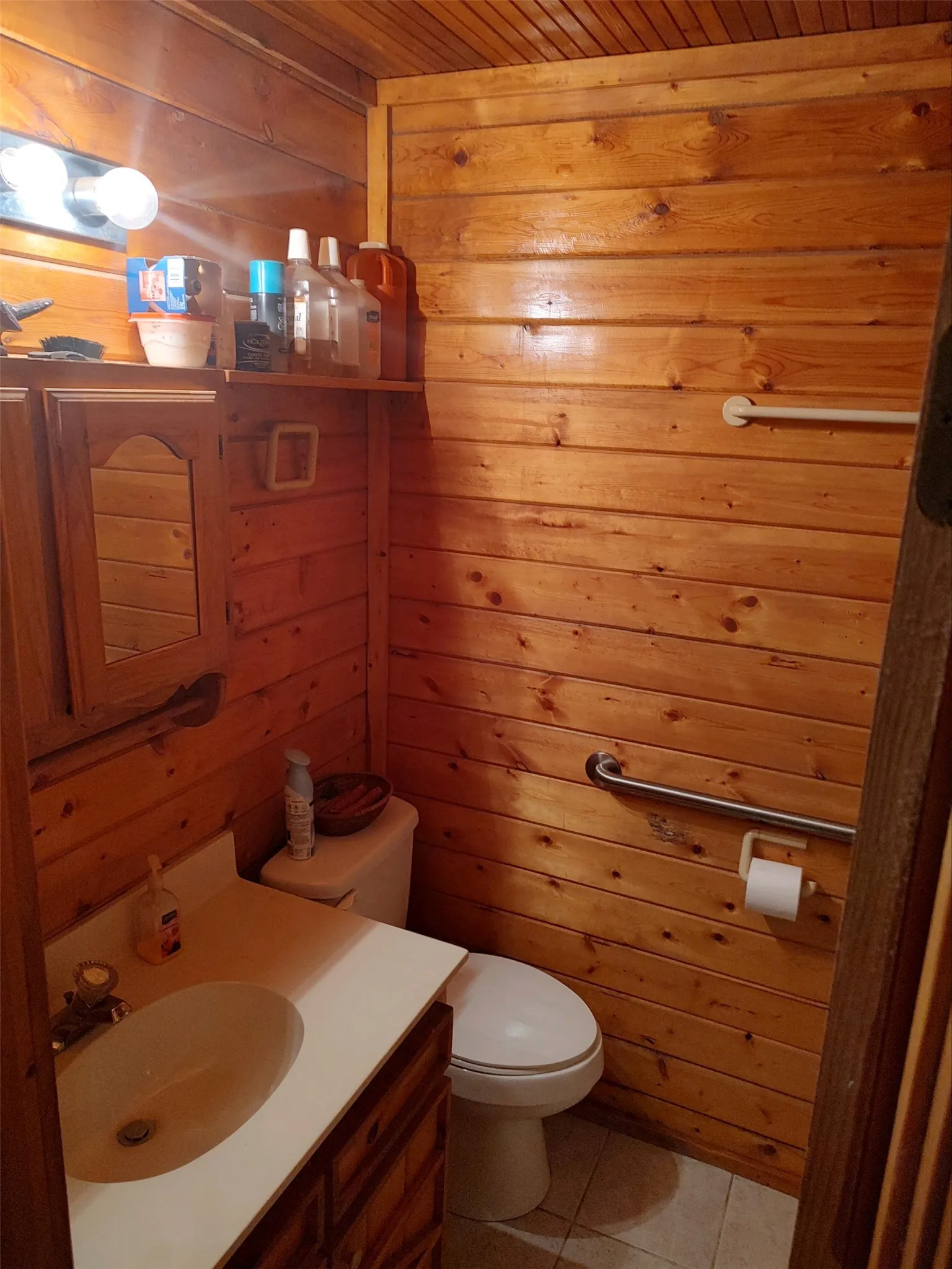 Guest bathroom with shower and pantry.