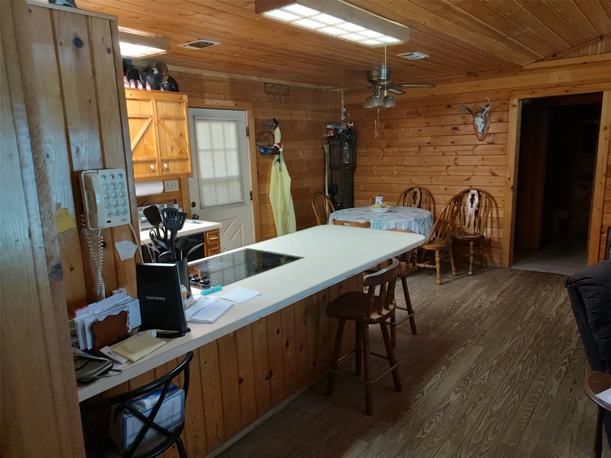 Kitchen bar with dining area and back door.