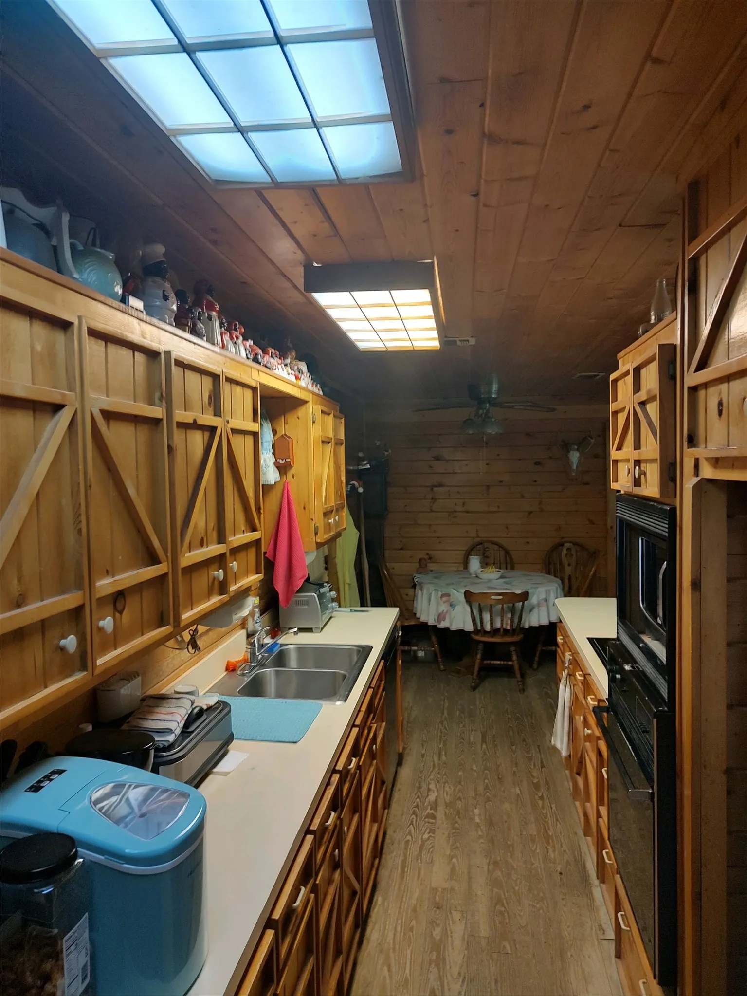 Kitchen with dining area in background.
