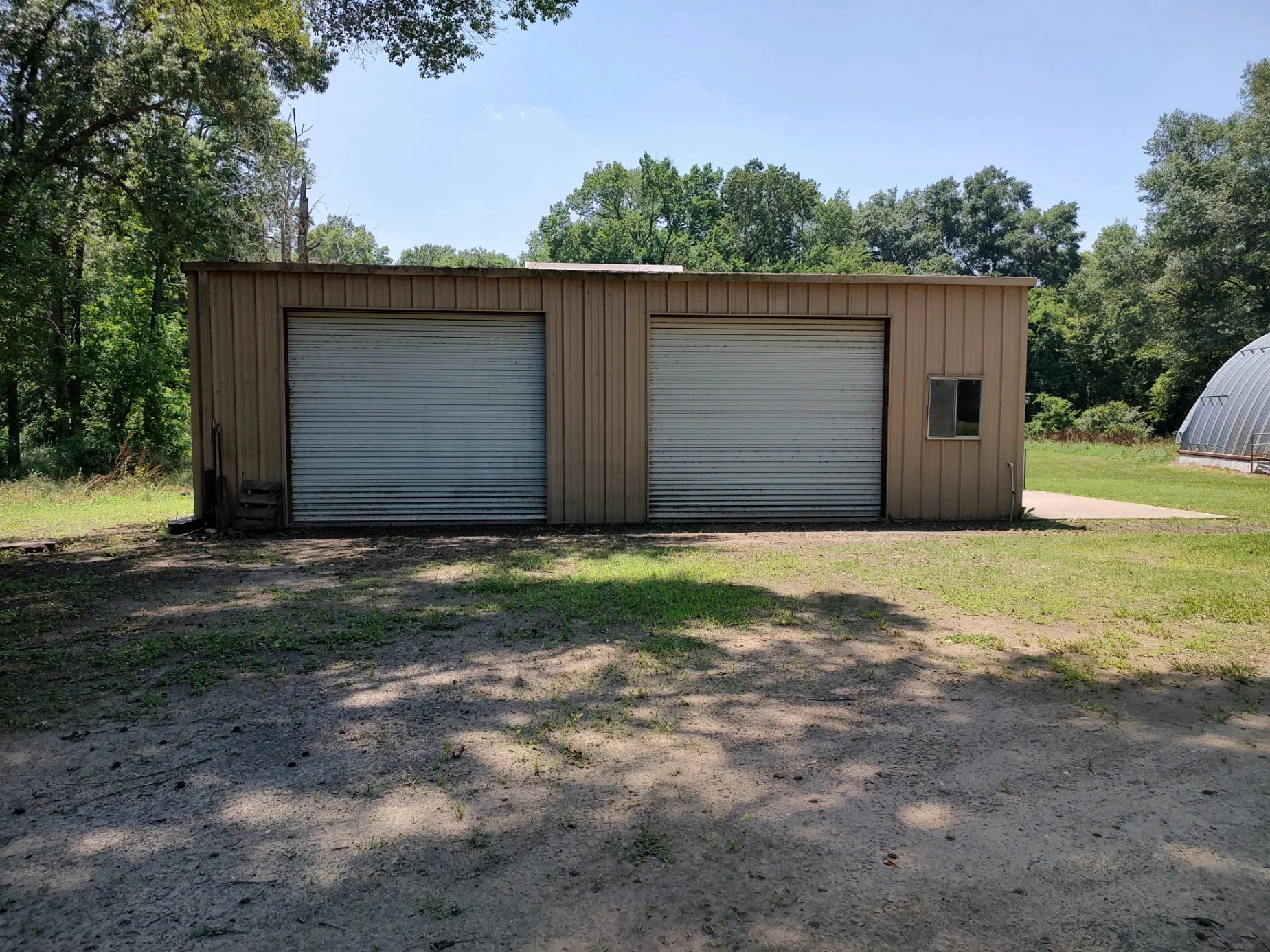 30 X 40 shop with electricity, skylights, 2 rollup doors and 1 walk-through door.