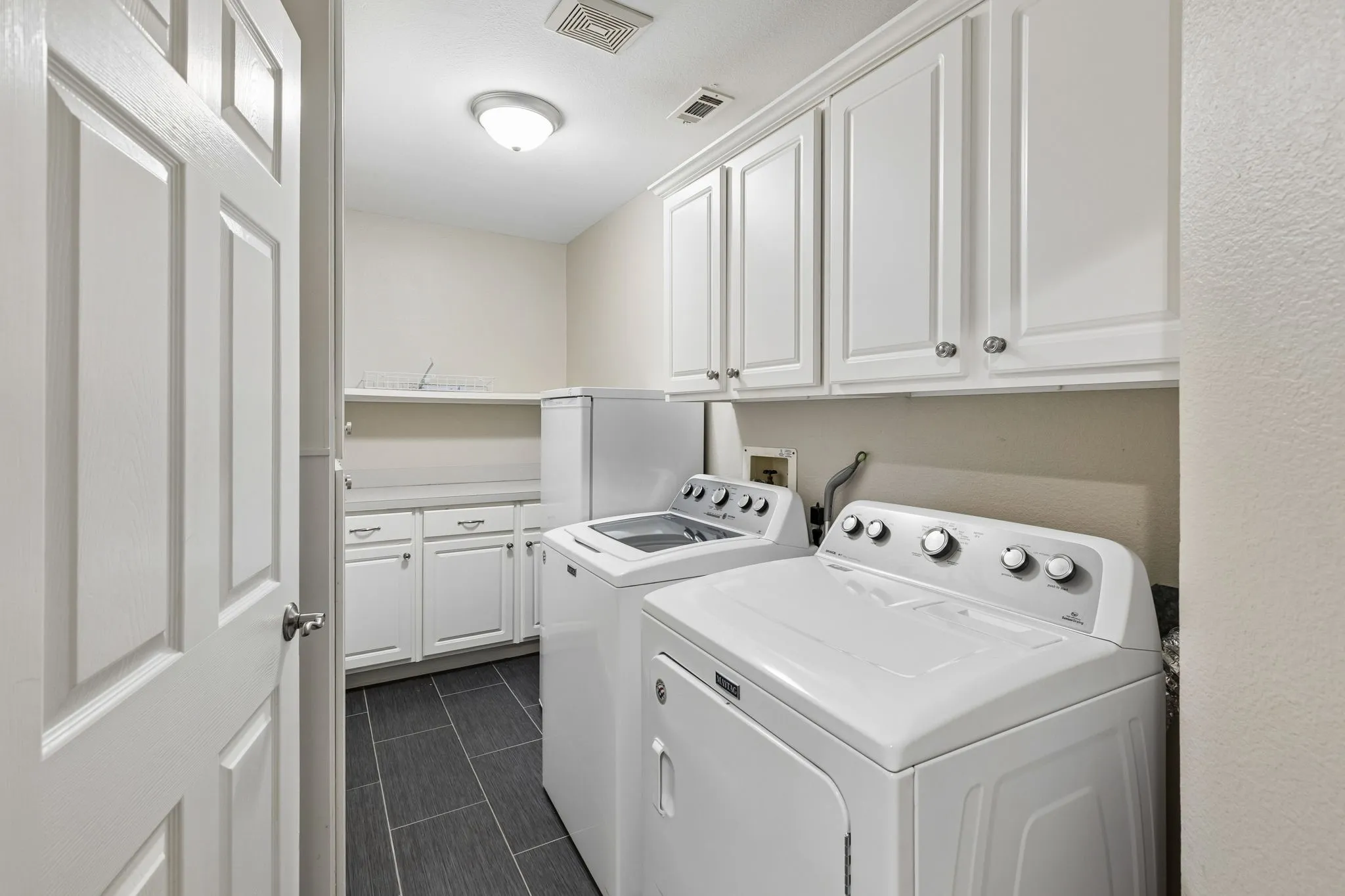 Laundry room with storage