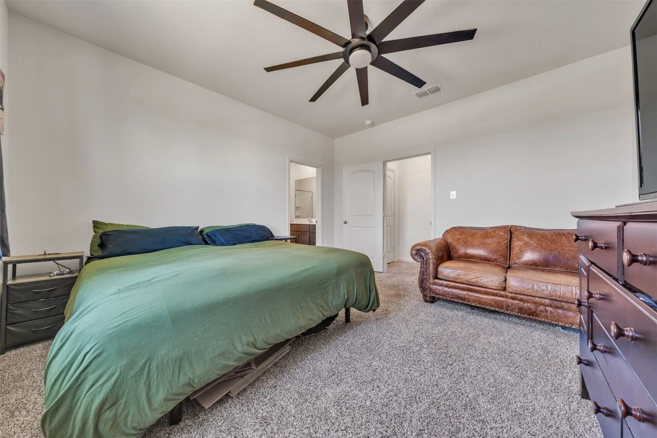 Recessed lighting, ceiling fan, and light gray carpeted flooring