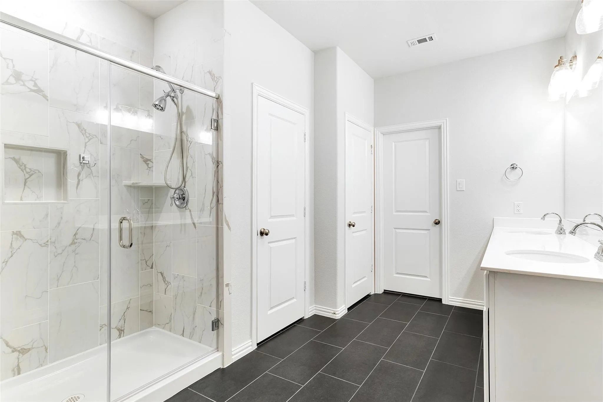 Primary bathroom with oversized shower, dual sinks, and separate linen​​‌​​​​‌​​‌‌​‌‌​​​‌‌​‌​‌​‌​​​‌​​ closet