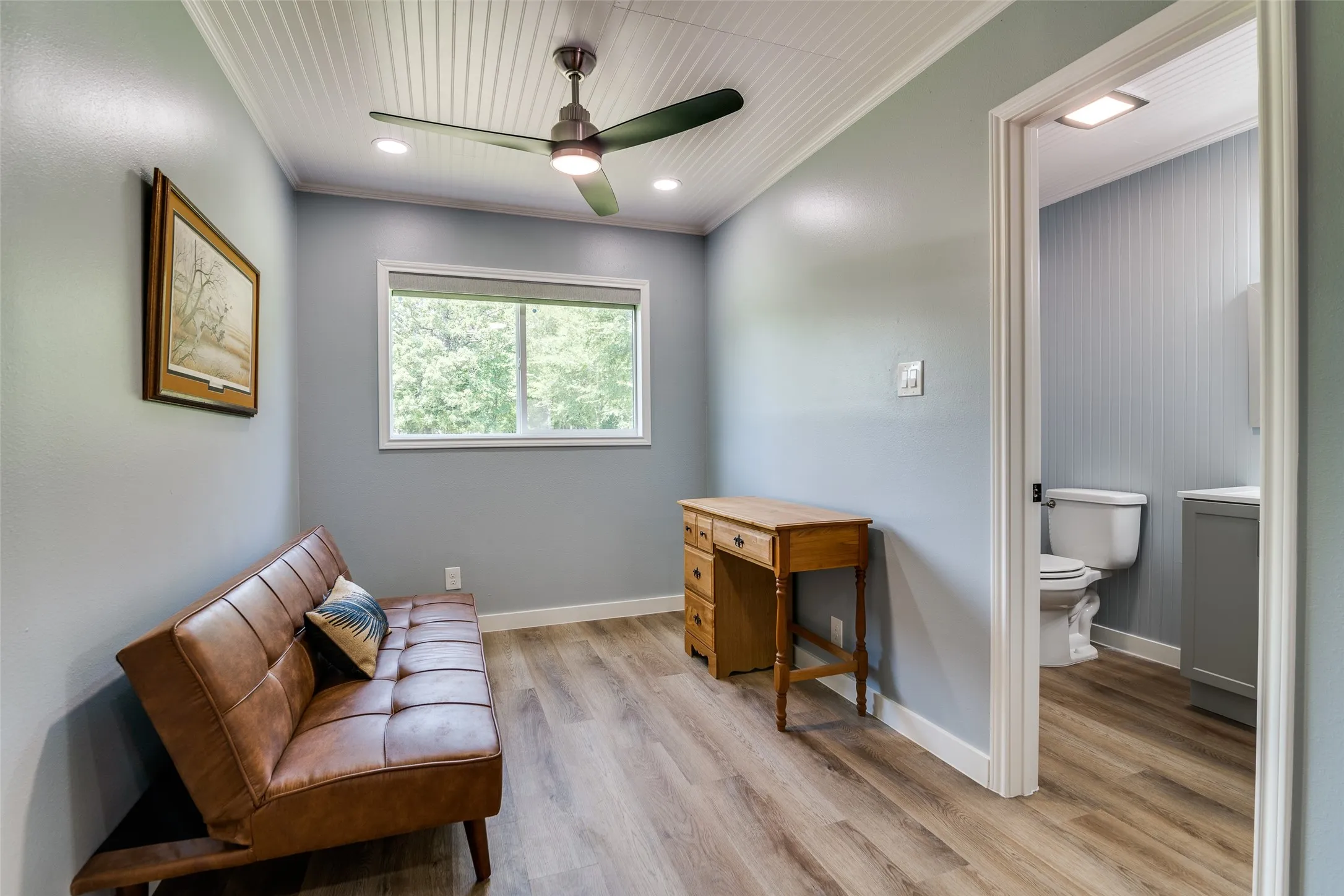Wood-finish flooring, recessed lighting, and a ceiling fan