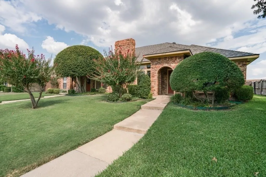 Front entry has an arched opening.