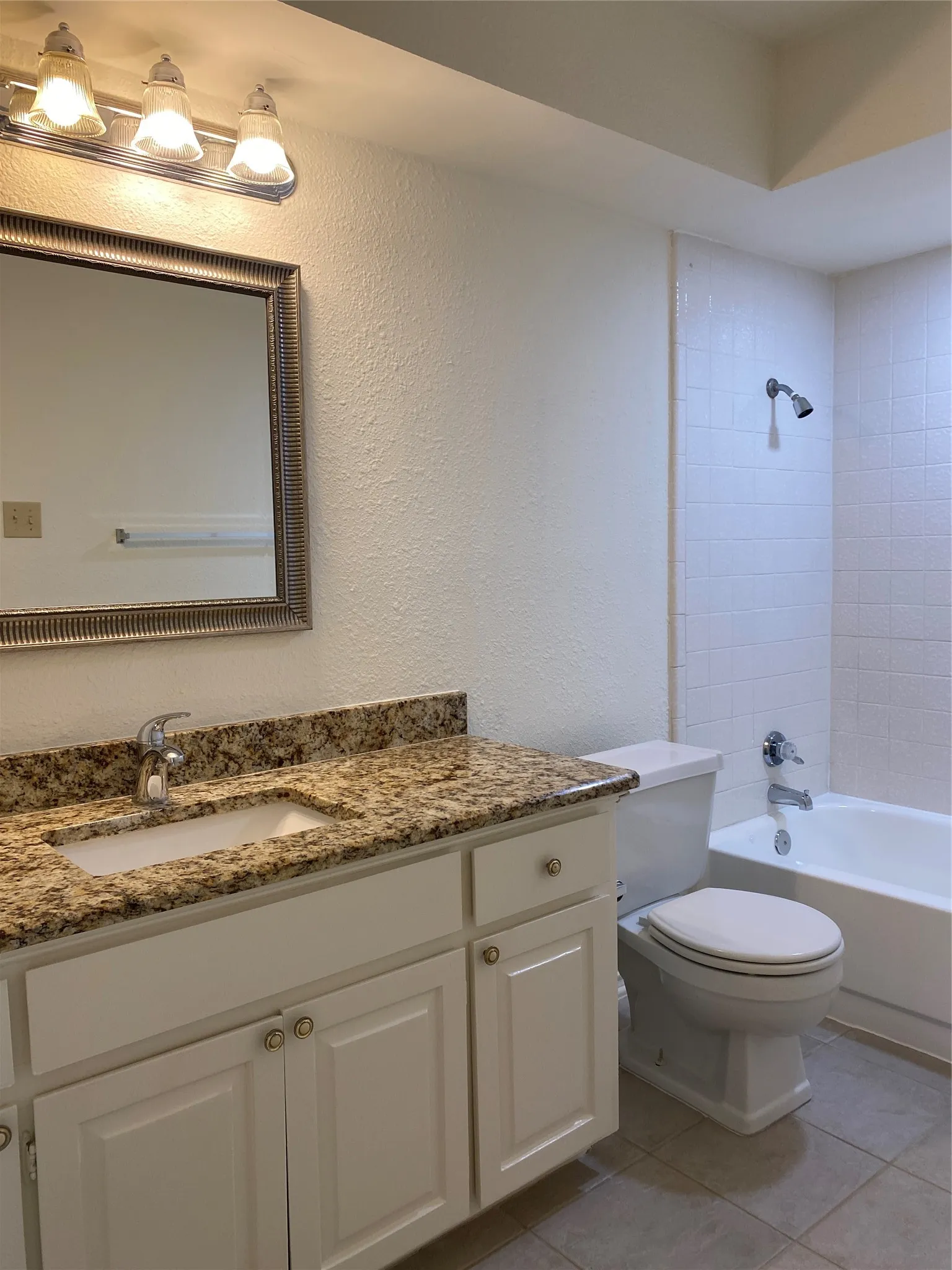 Granite tops, fresh painted cabinets, updated fixtures.