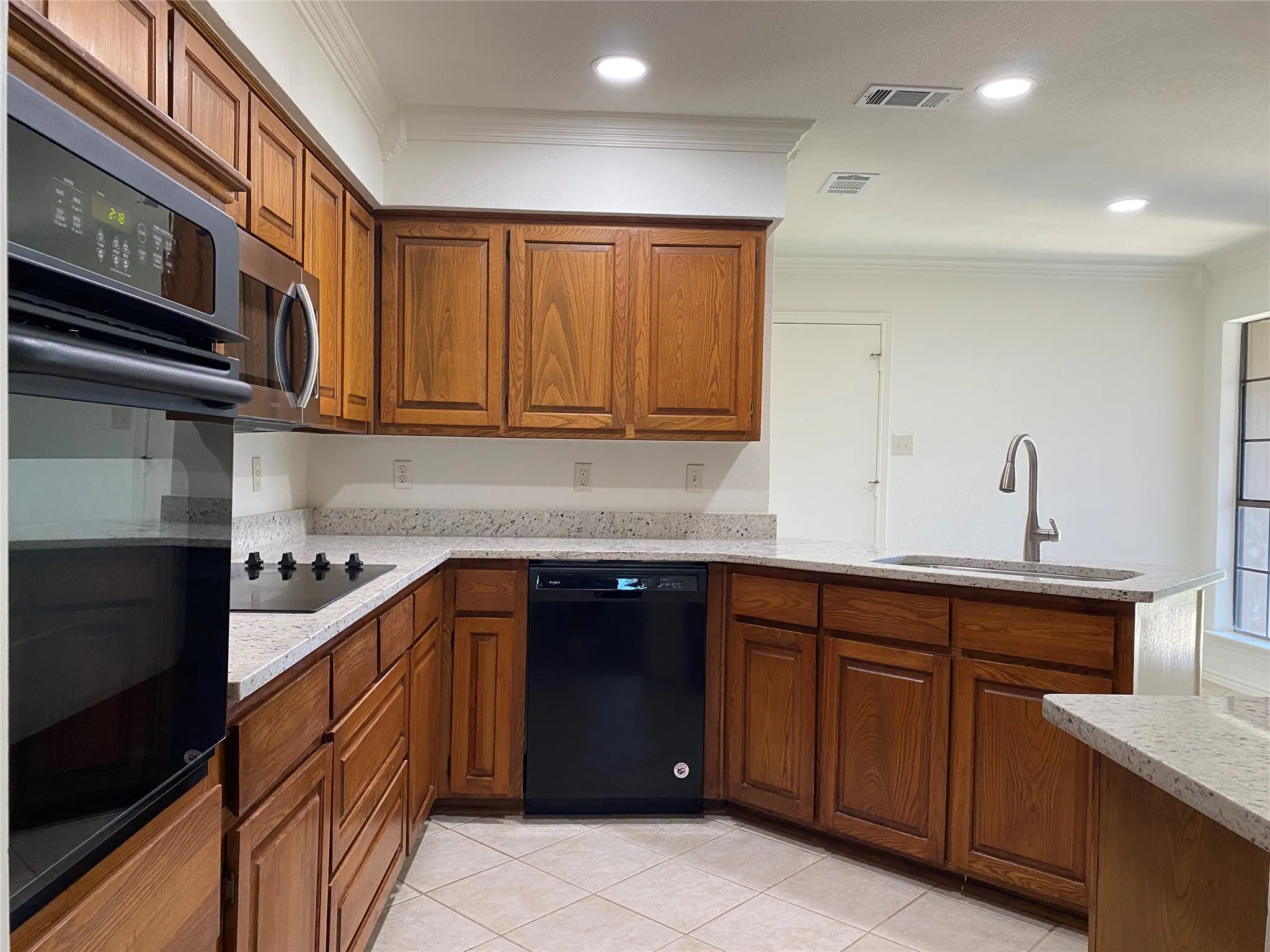 Spotless kitchen and freshly painted interior of cabinets.