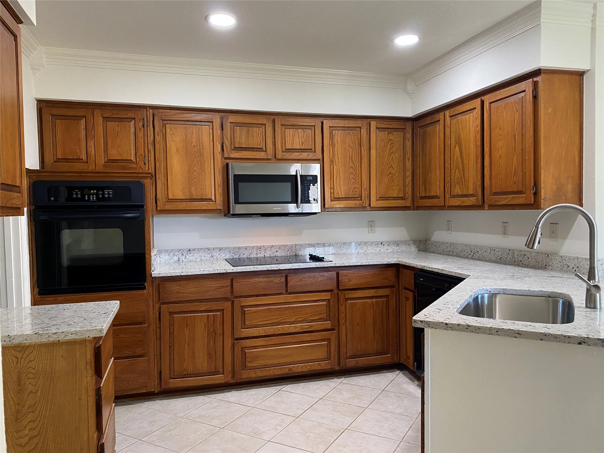 All new: Smooth glass cooktop; Built-in microwave; Single-Bowl sink with gooseneck faucet; Ganite counter tops; Recessed lighting.