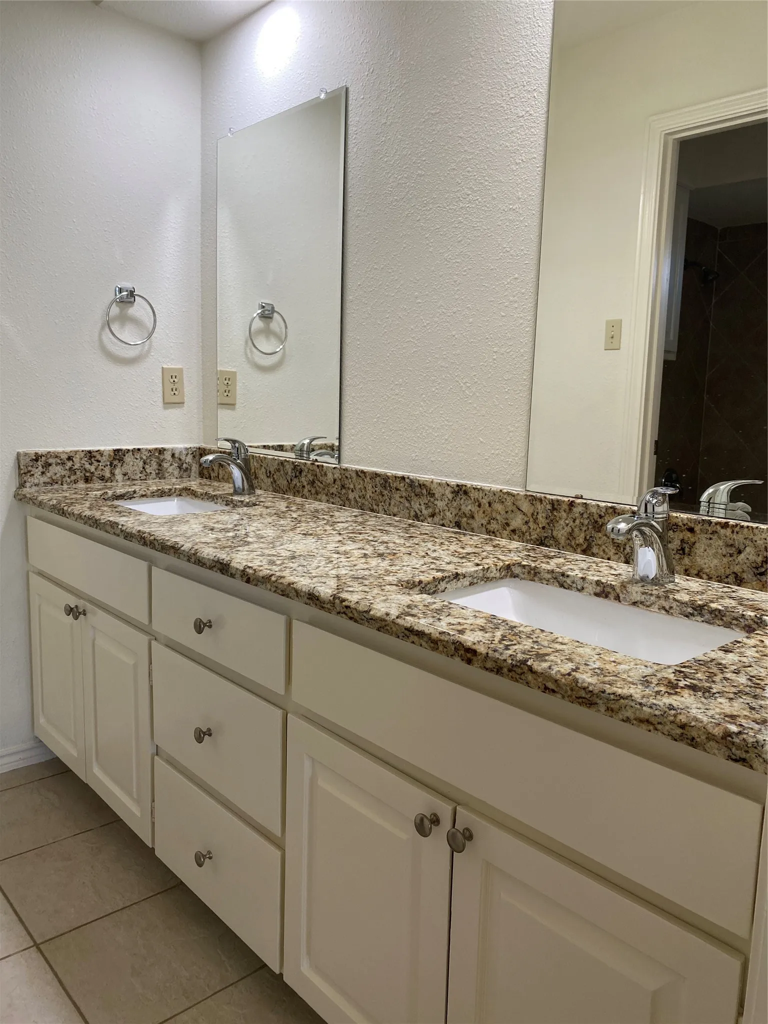 Double sinks in the primary bath. Separate toilet room and tub area.