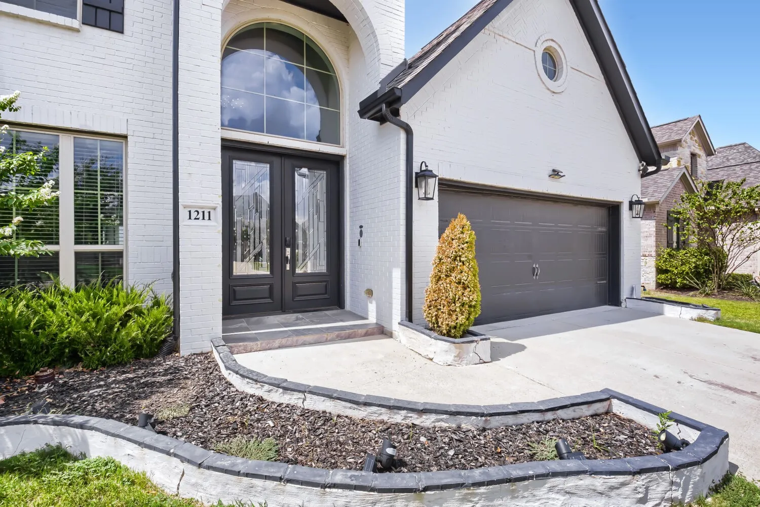 White brick exterior with black trim accents