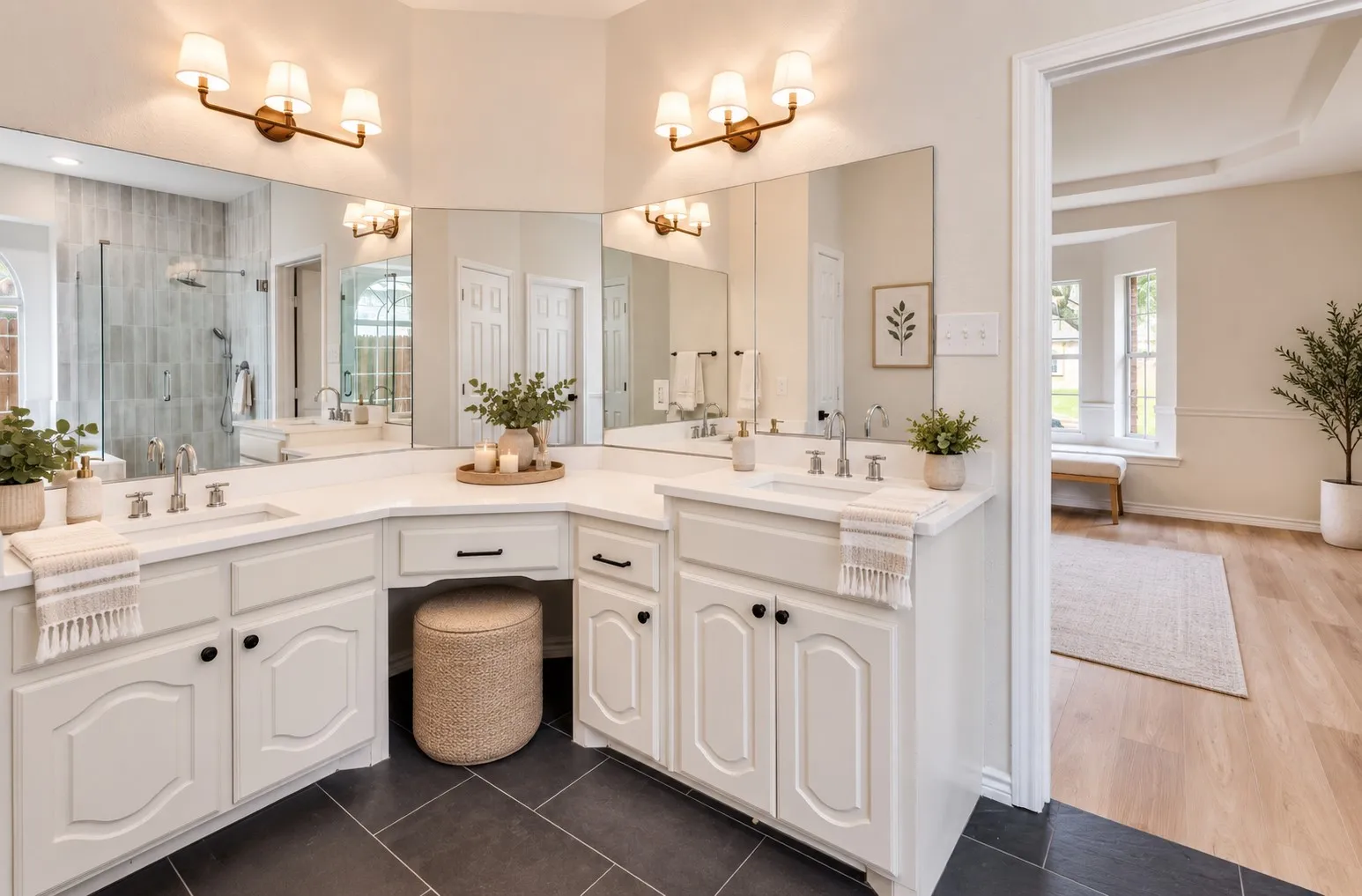 Dual vanity with white cabinetry, integrated sinks, and polished chrome fixtures