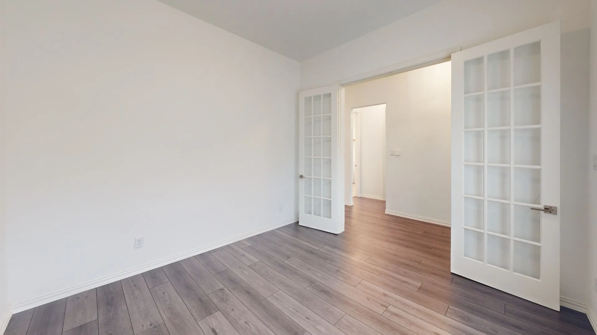 Wood-finish flooring complemented by white walls