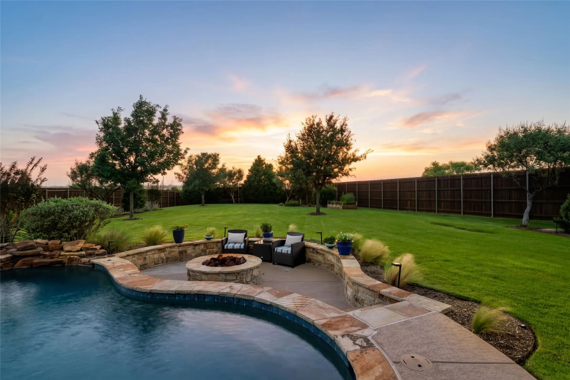 Step Down Firepit Area Overlooking the Pool...