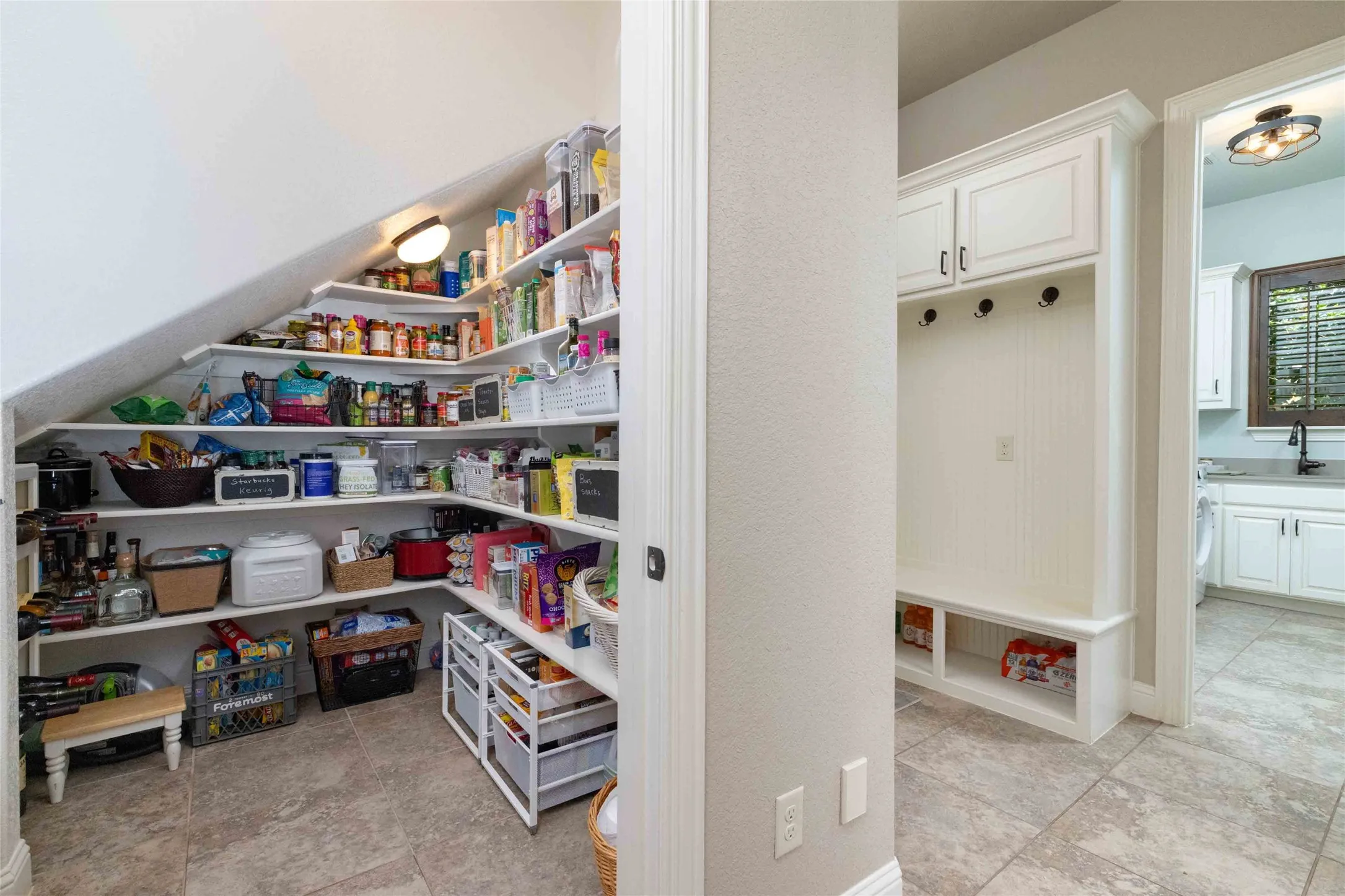 HUGE Pantry Tucked Away in Hall & Convenient Mud Area Coming in from the Garage...