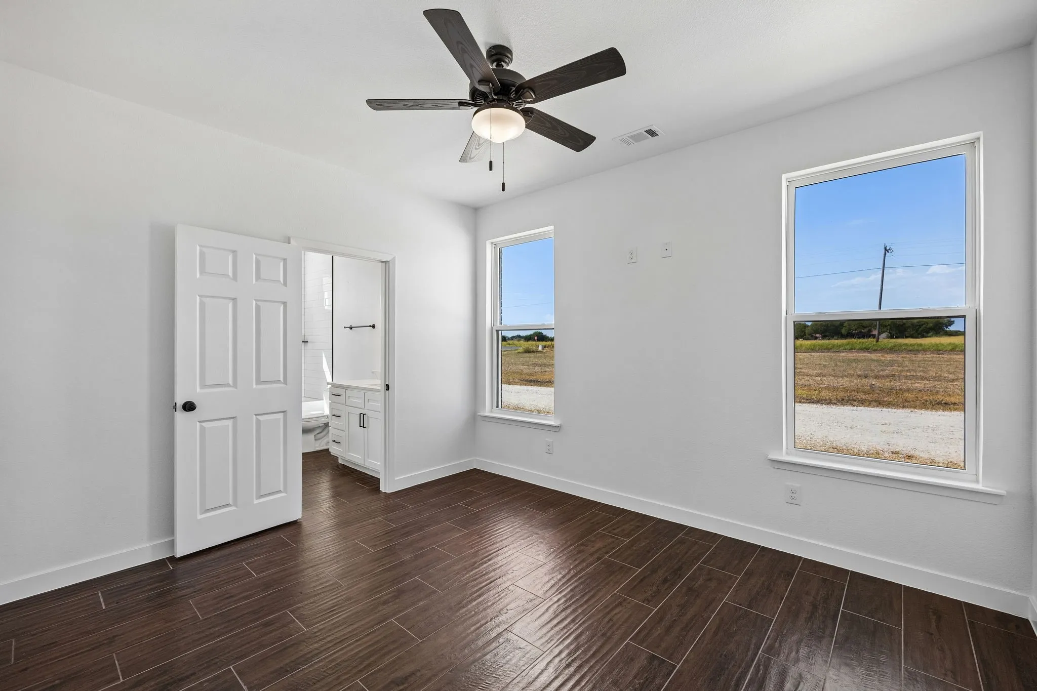 Secondary Bedroom 11 ft X 13 ft on southwest side of property shares bathroom with other secondary bedroom