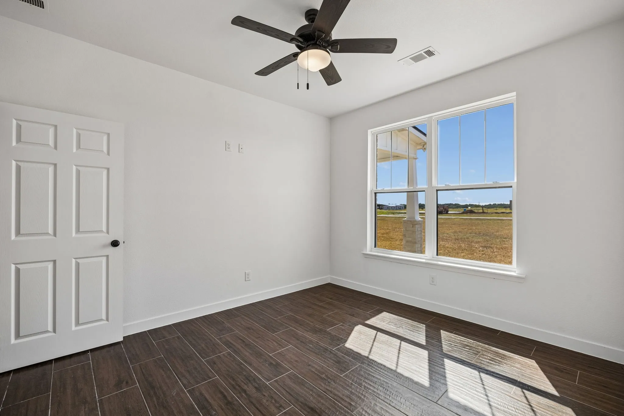 Secondary bedroom 11 ft X 12 ft with window facing front of property