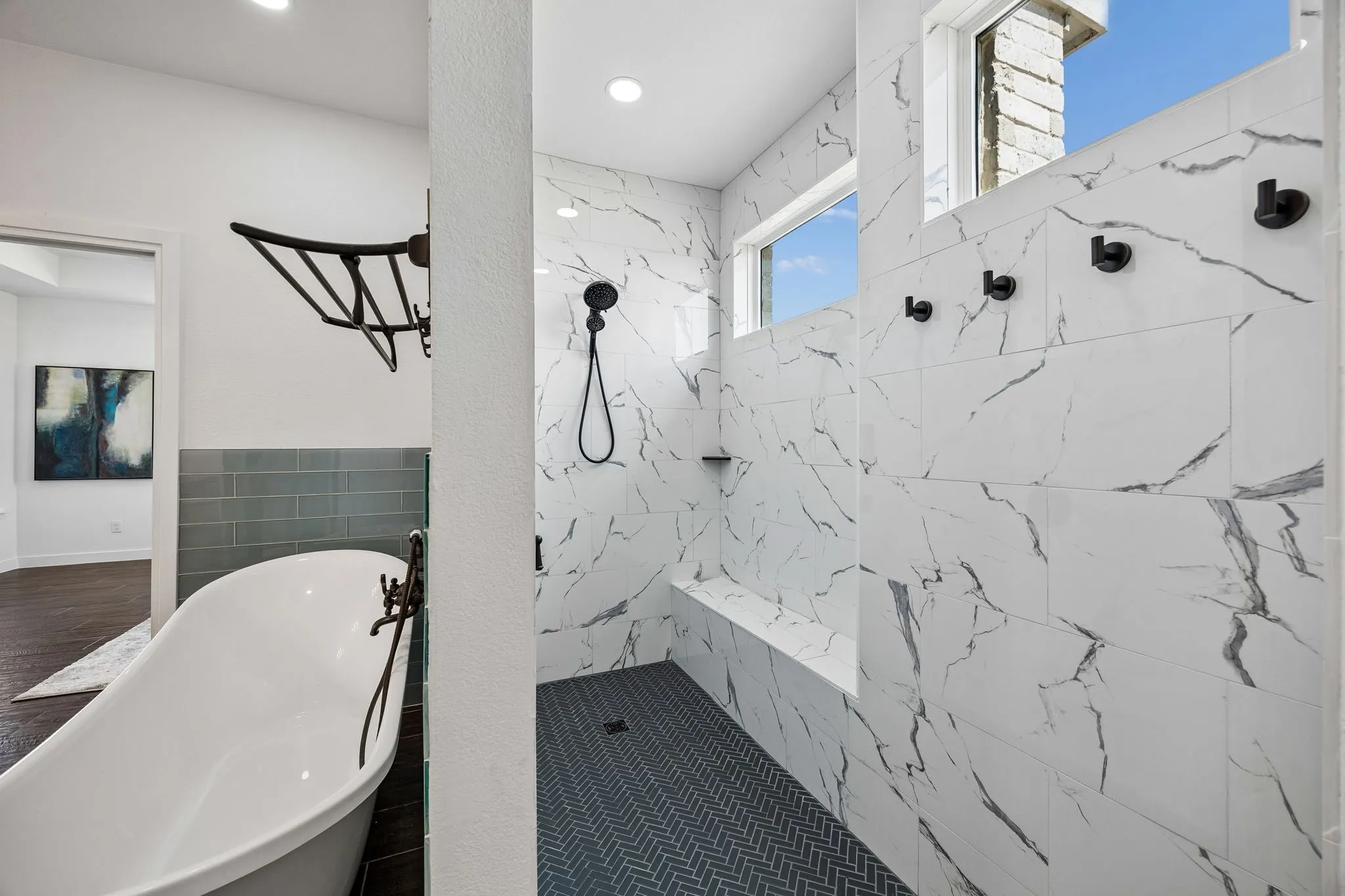 View of freestanding or standalone tub and separate large luxurious shower