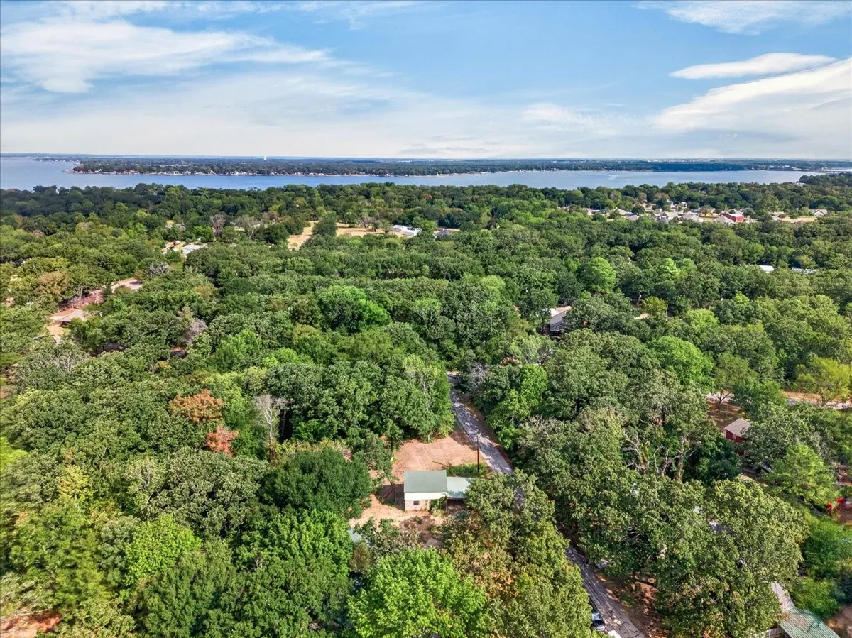 Wooded acreage with a distant body of water