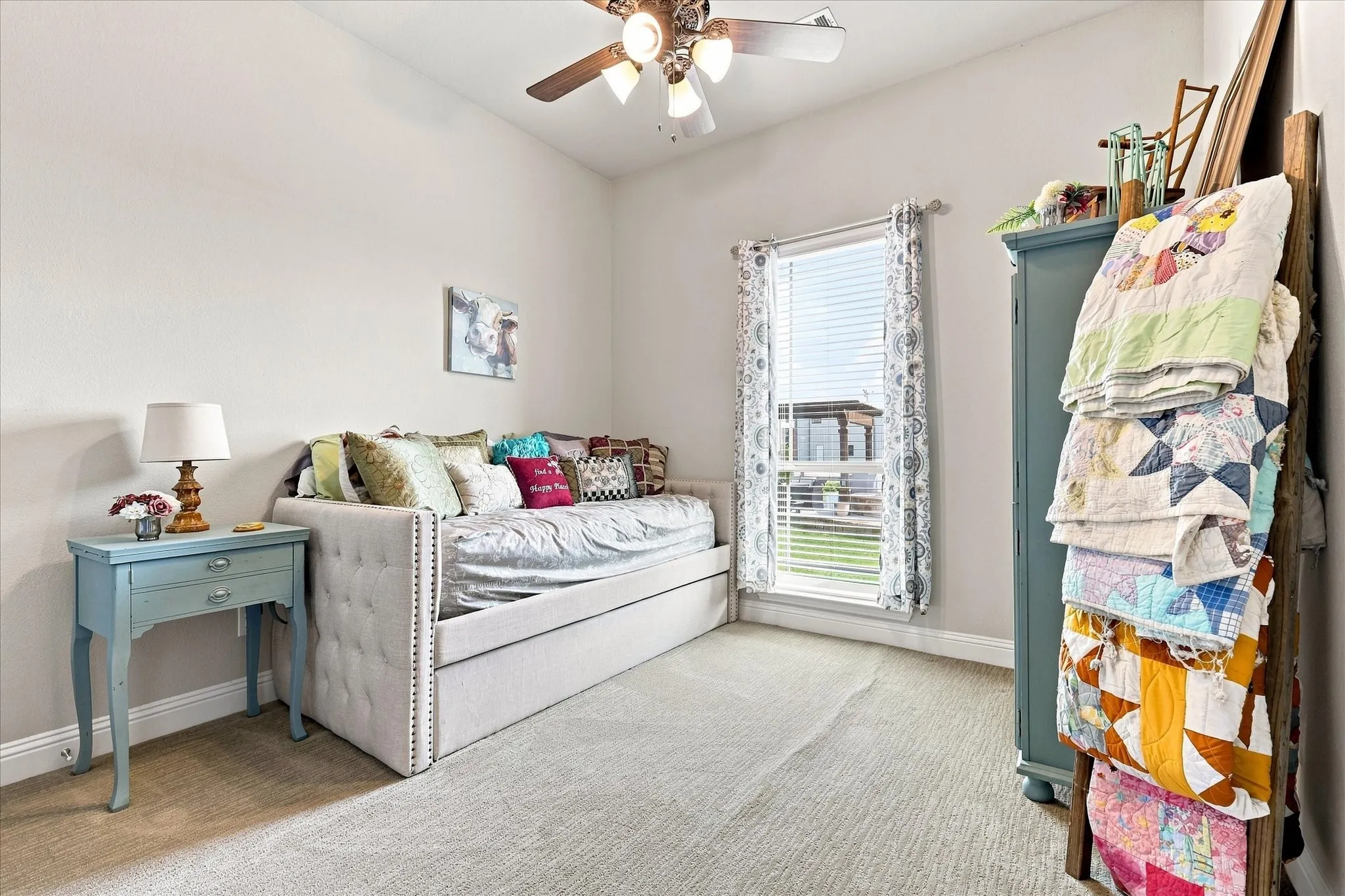 High ceilings, neutral wall tones, window with blinds, and a ceiling fan with integrated lighting