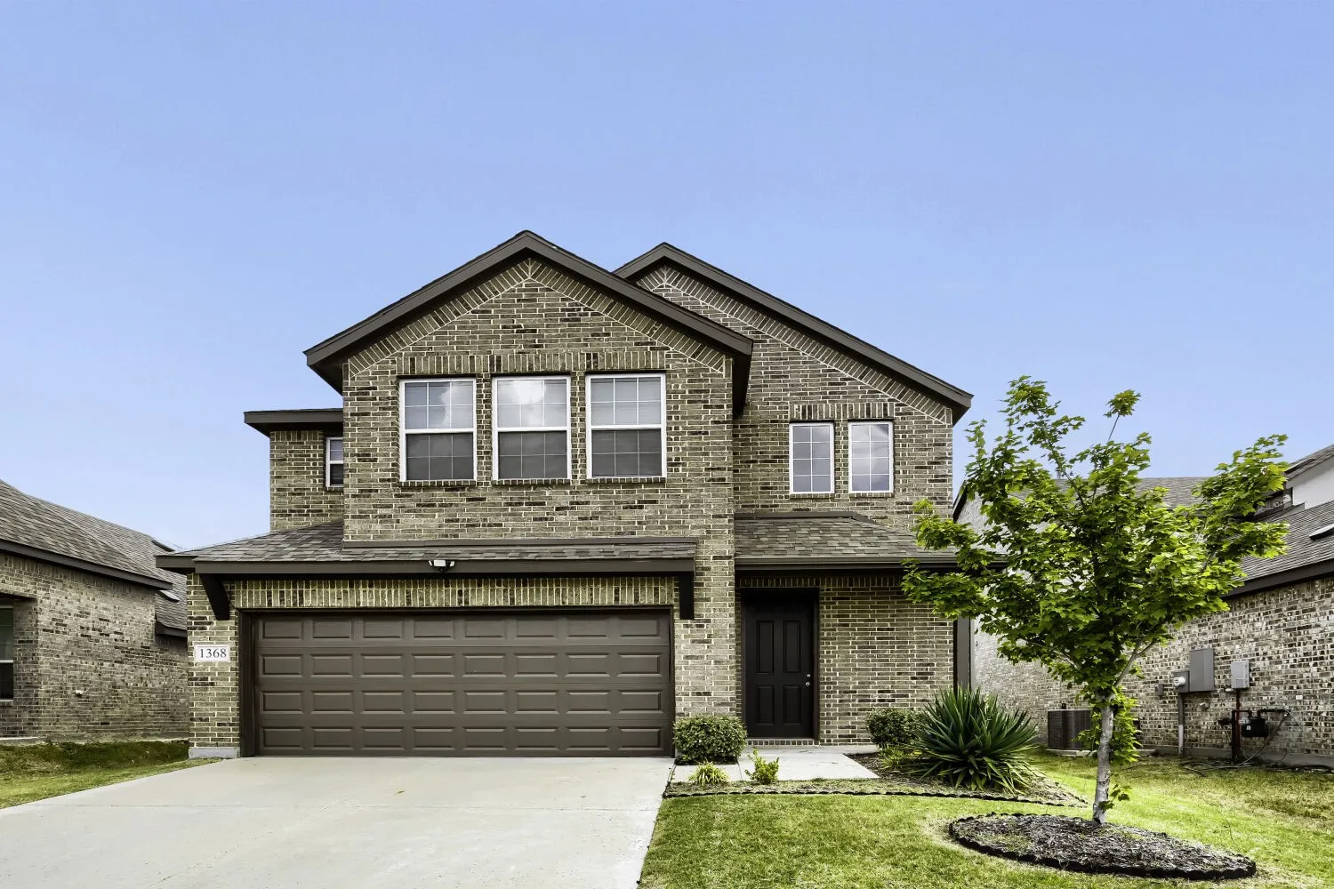 Brick exterior with complementary asphalt shingle roof