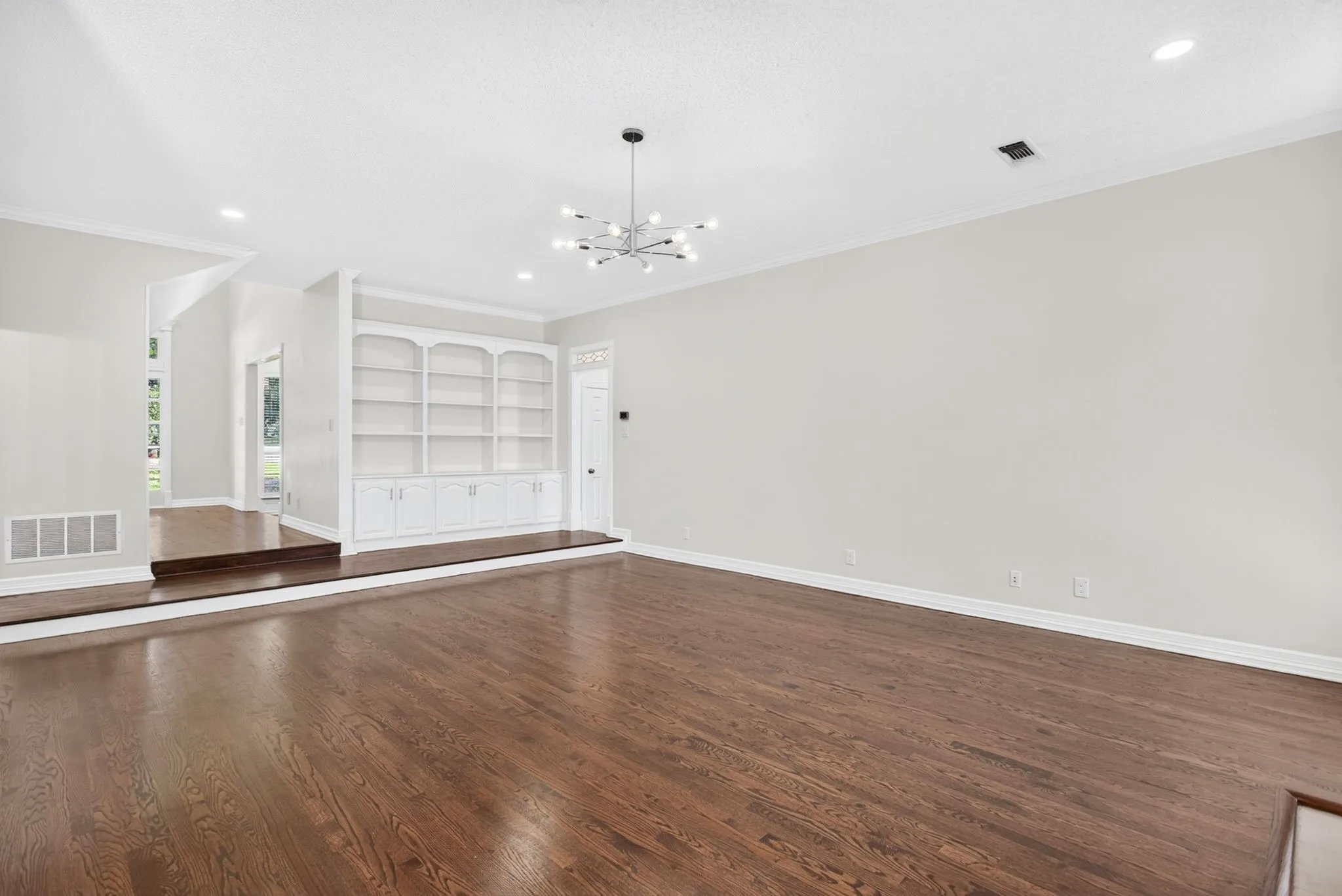Living Room with fire place and built-in shelving