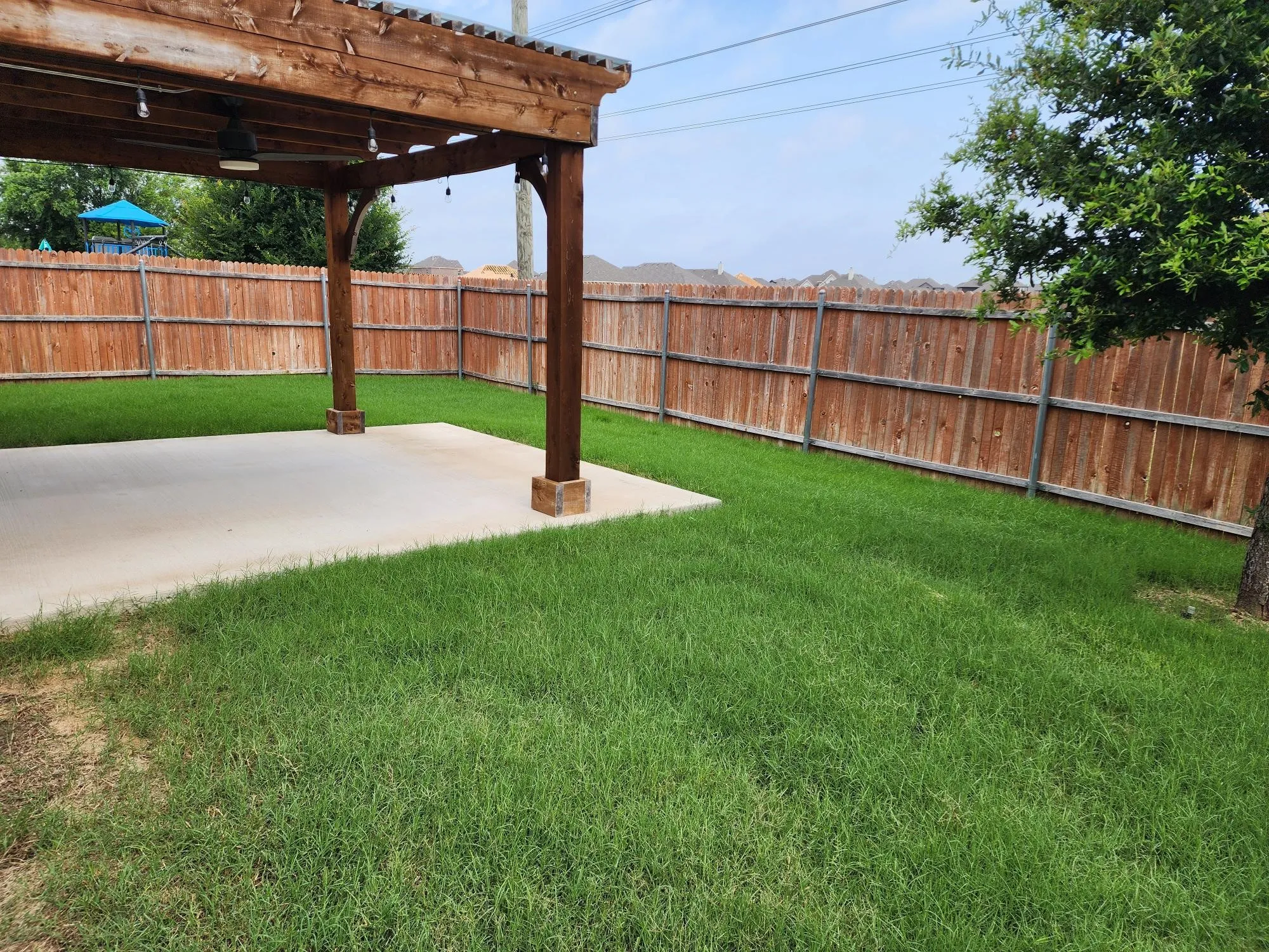 View of yard with a pergola and a patio area