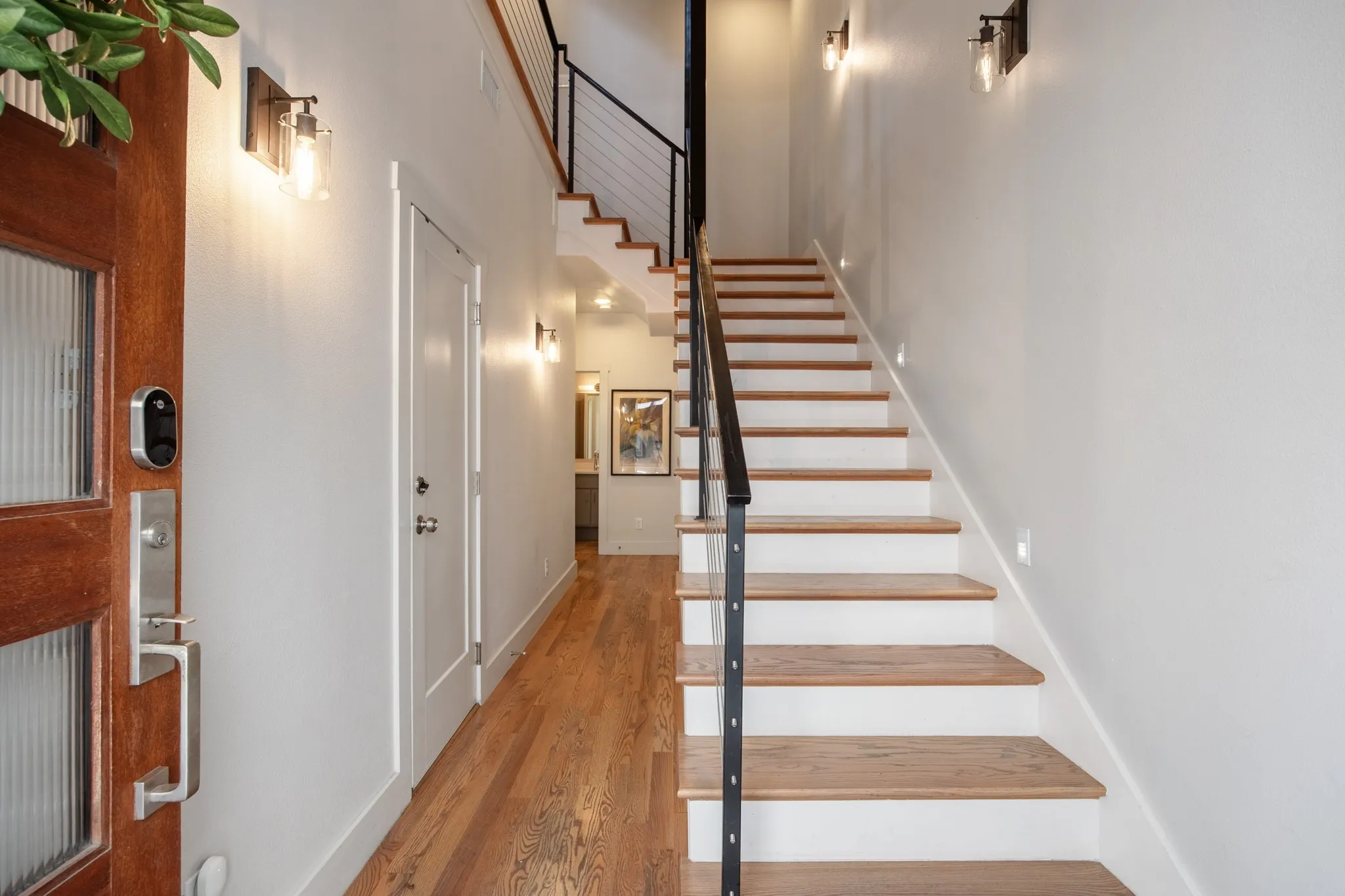 Entry foyer with open-riser staircase