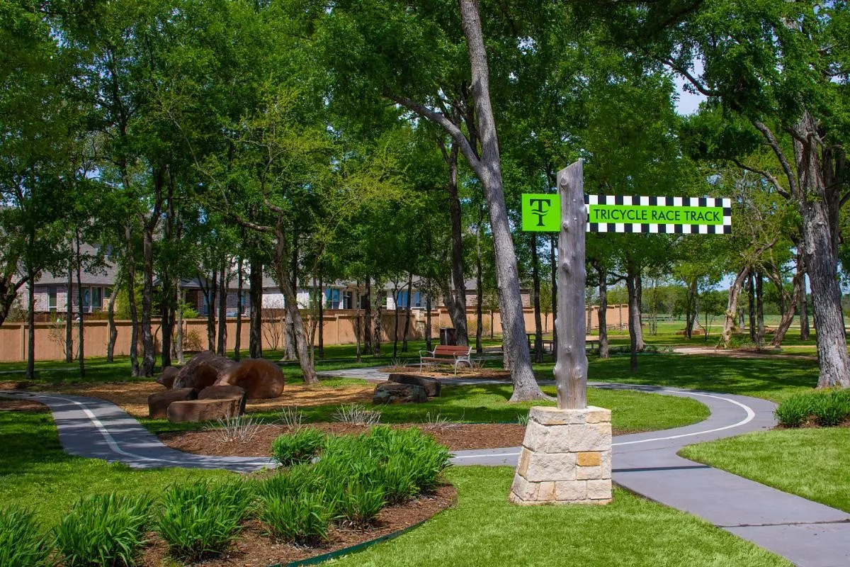 Trinity Falls photo from their website showing one of the many amenities, trails, pools, gym and parks in the community.