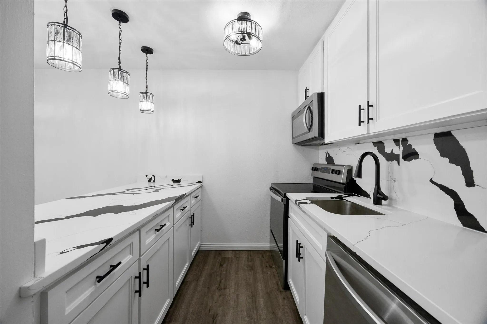 Original updated kitchen featuring white cabinetry, matte black hardware, soft close drawers, and generous storage.