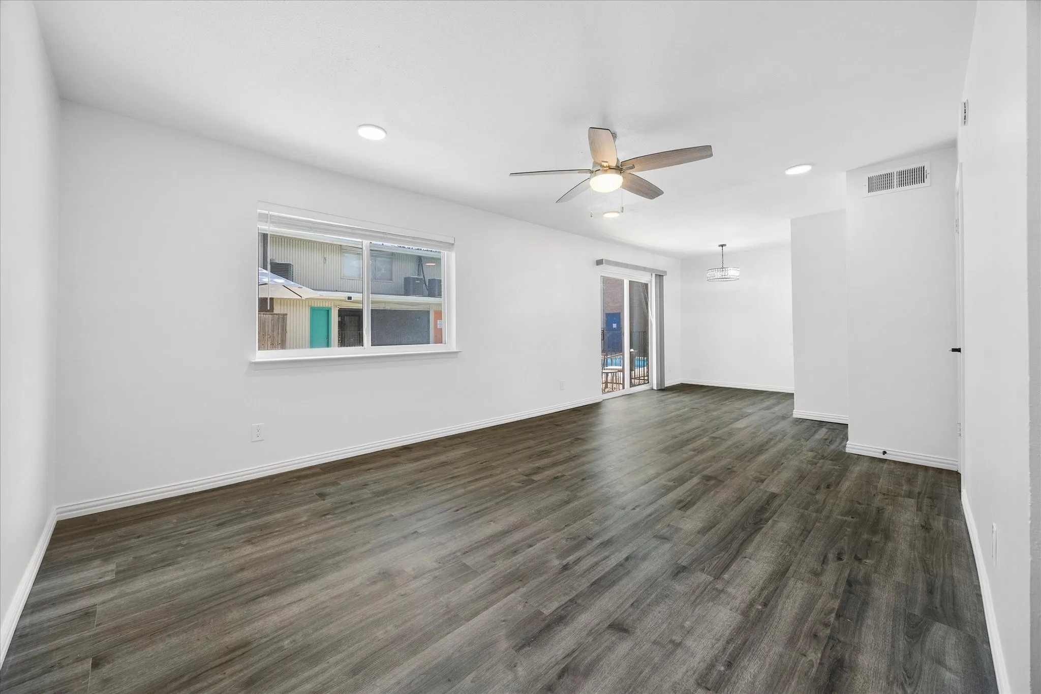 Original view from the front entry into the open living area.
