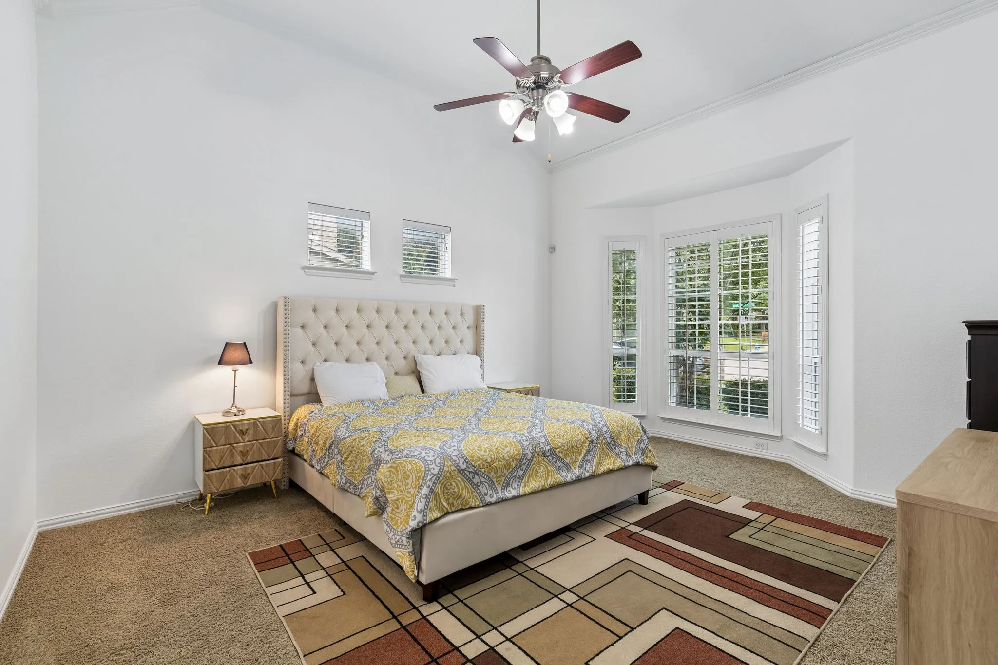 Vaulted ceilings and a ceiling fan with integrated lighting