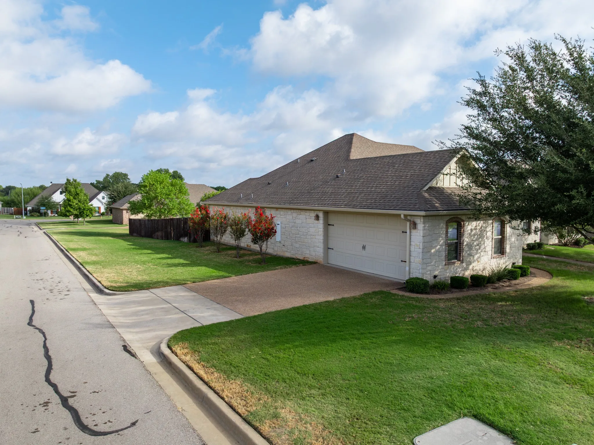 Garage entry.  Austin Stone exterior.