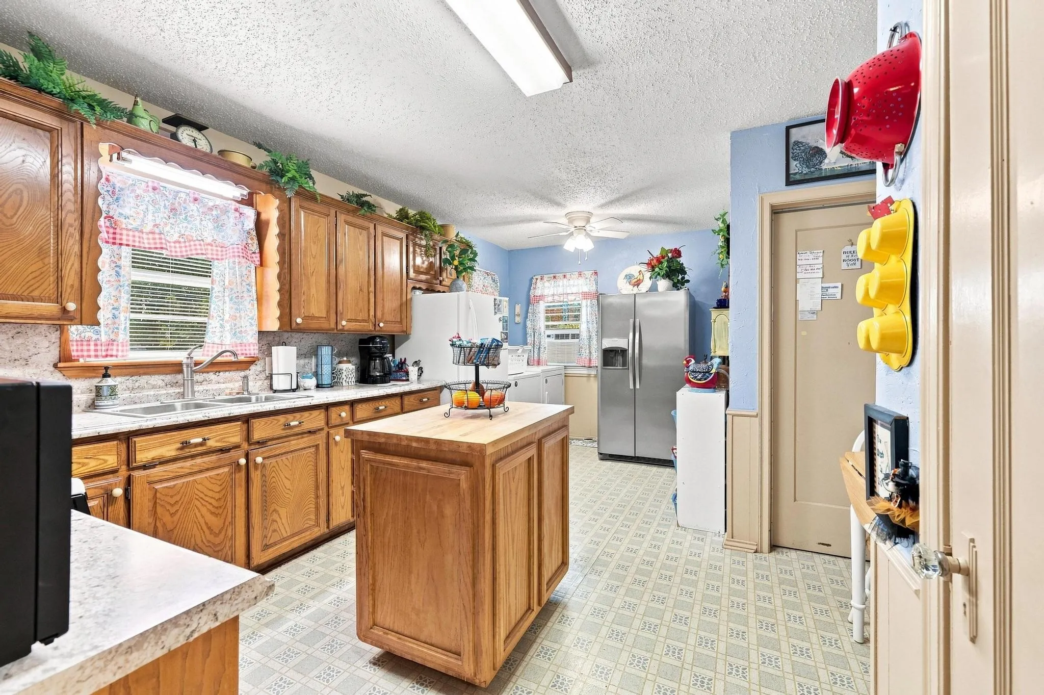 kitchen has tons of cabinets for lots of storage