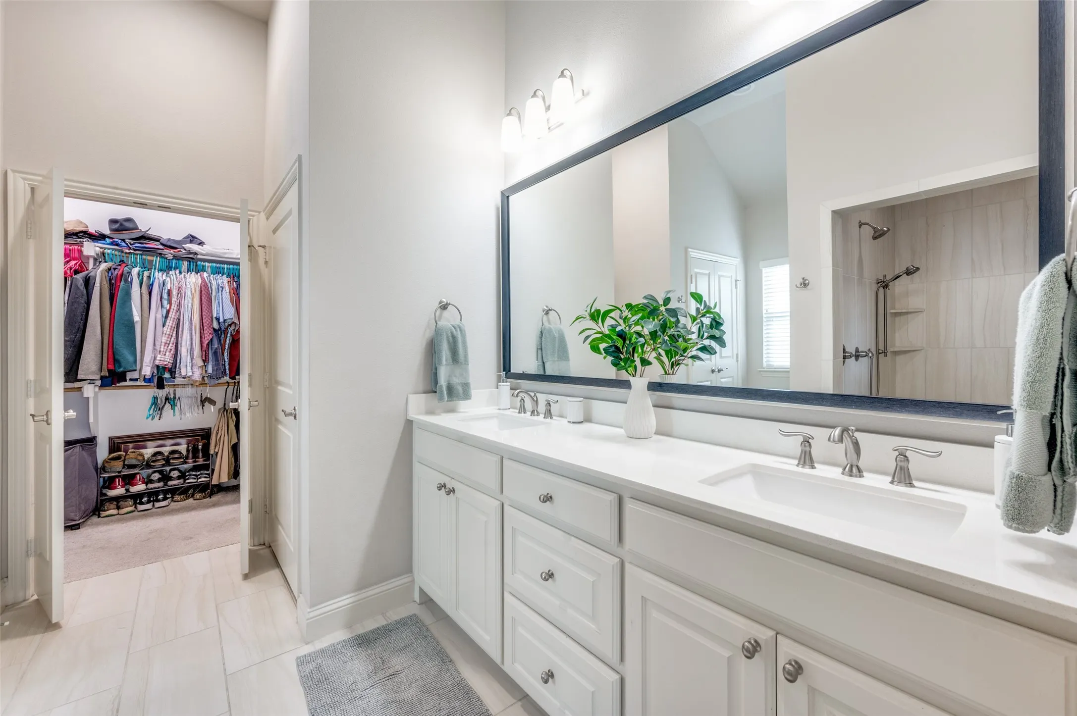 Dual vanity with integrated sinks and brushed nickel fixtures