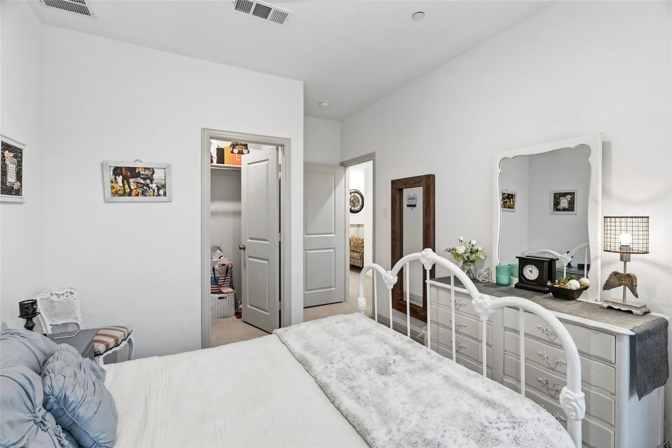 White walls with high ceilings, recessed ceiling light, and wall-to-wall carpeting