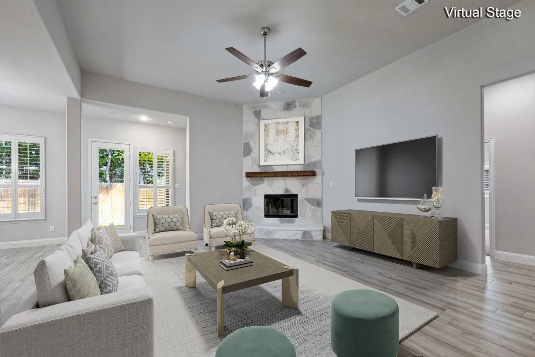 Virtually staged living area. There is wiring for a TV on the wall where the TV is seen in this picture.