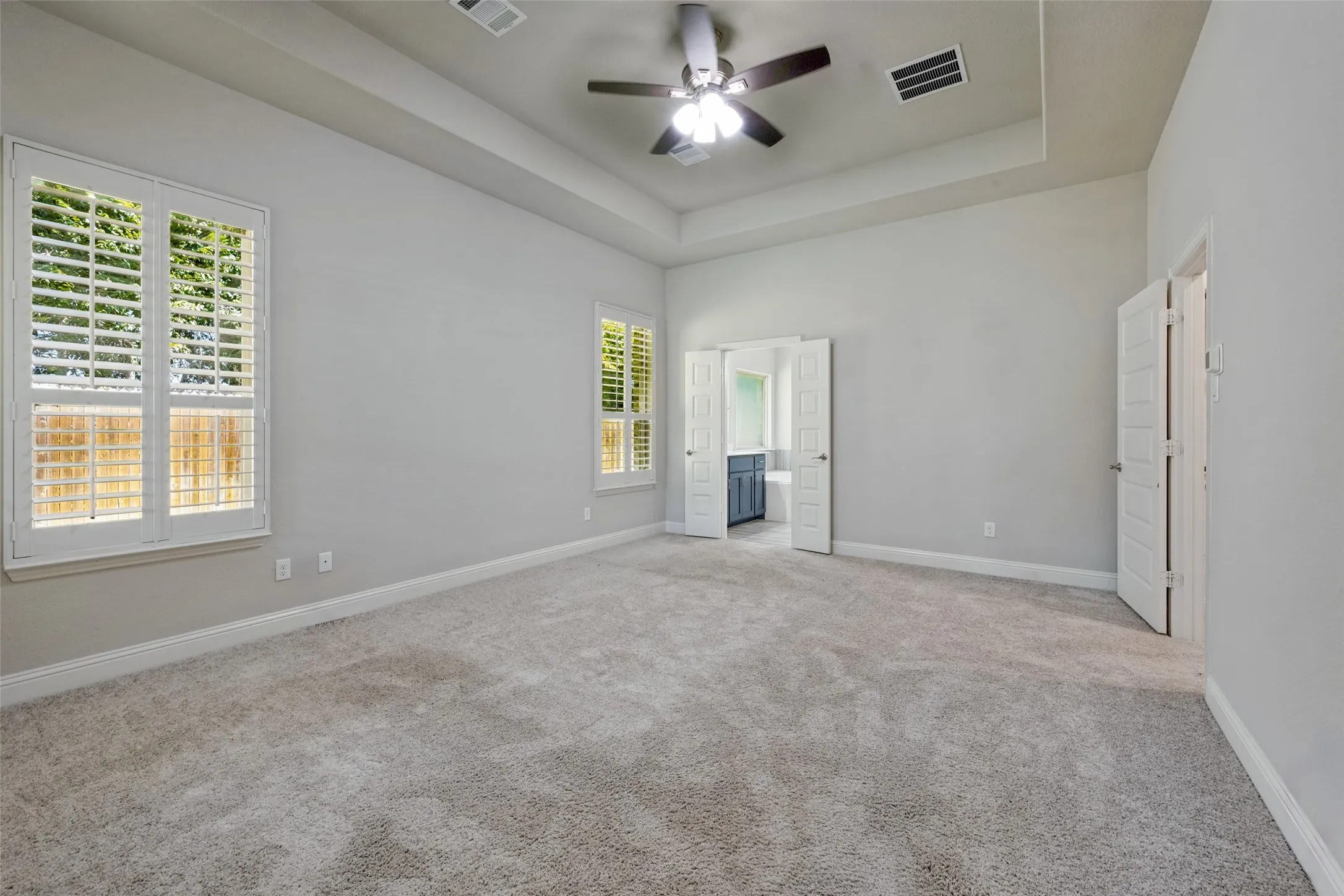 The primary bedroom features an ensuite bath and large walk-in closet.