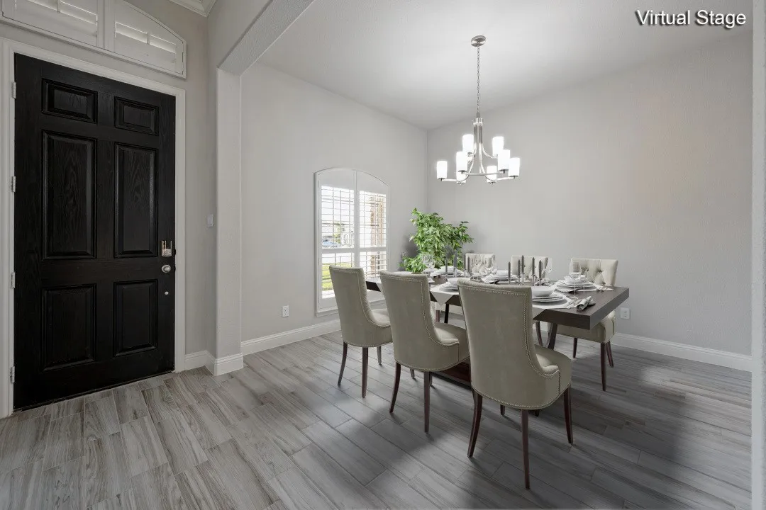 Virtually staged formal dining area.