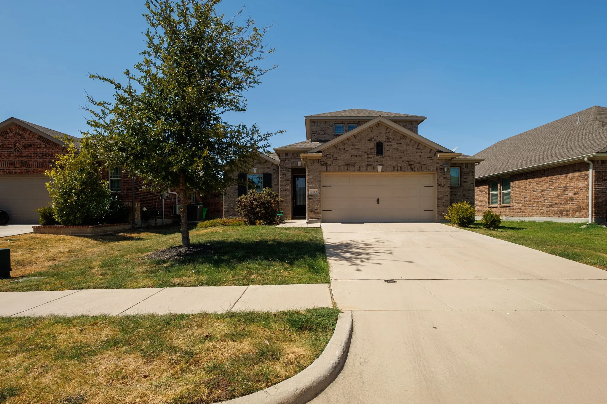 Brick-clad exterior with a two-car garage