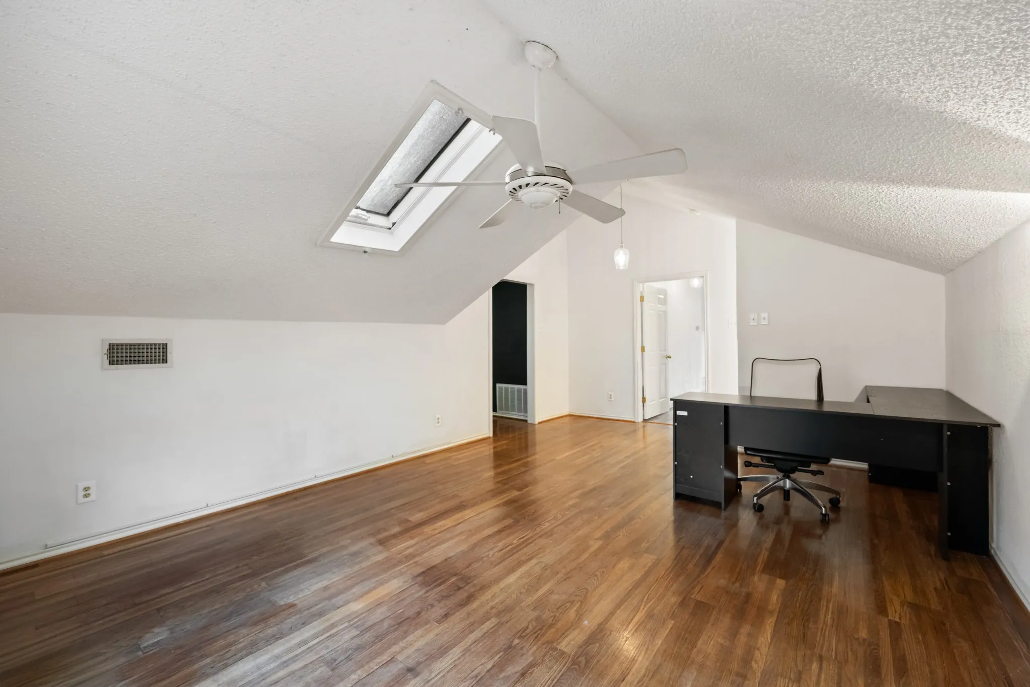 2nd Living area or potential incoming producing apartment with wood-finish flooring, vaulted ceiling, skylight