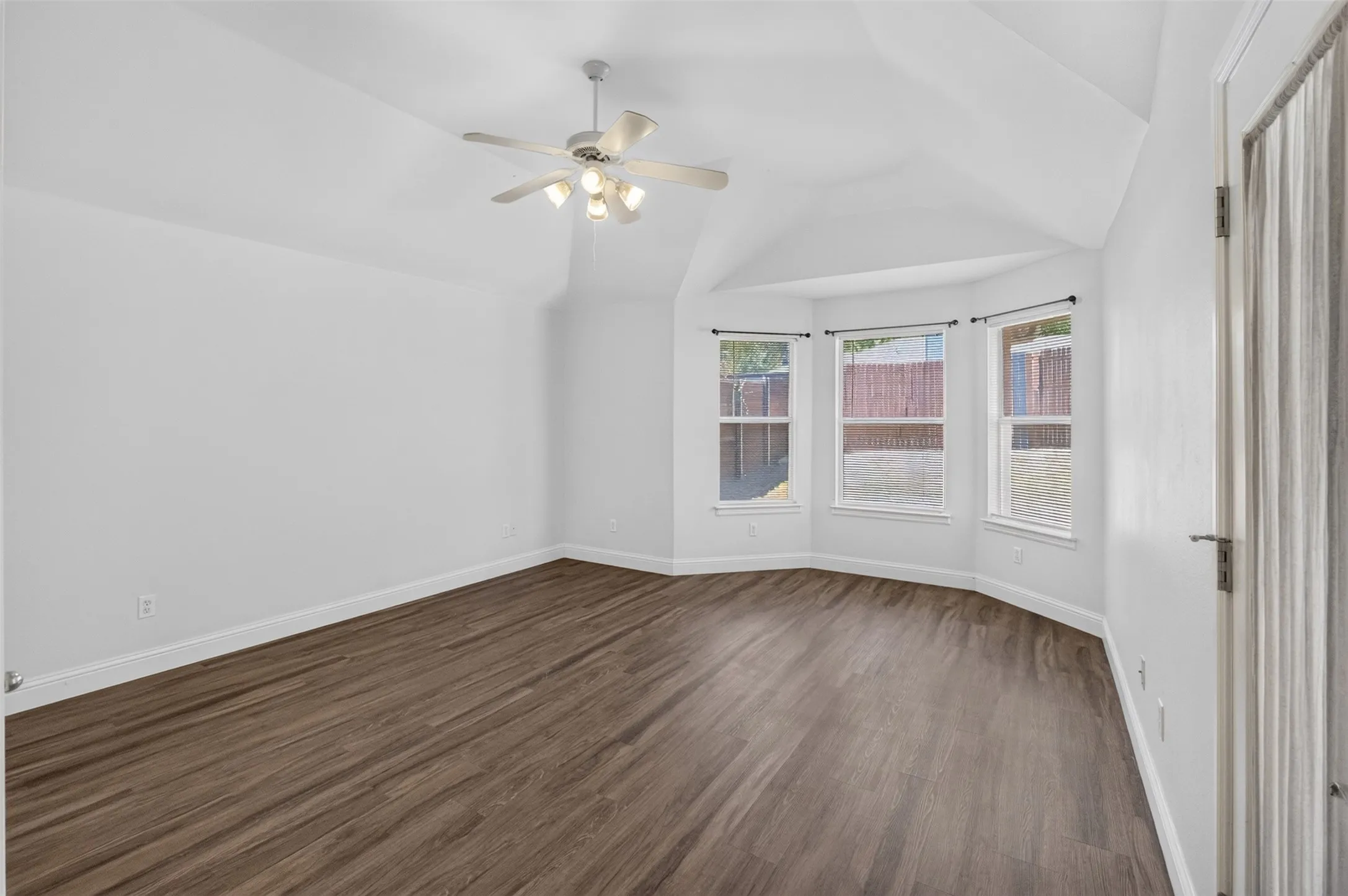 Master bedroom with entry to back patio.