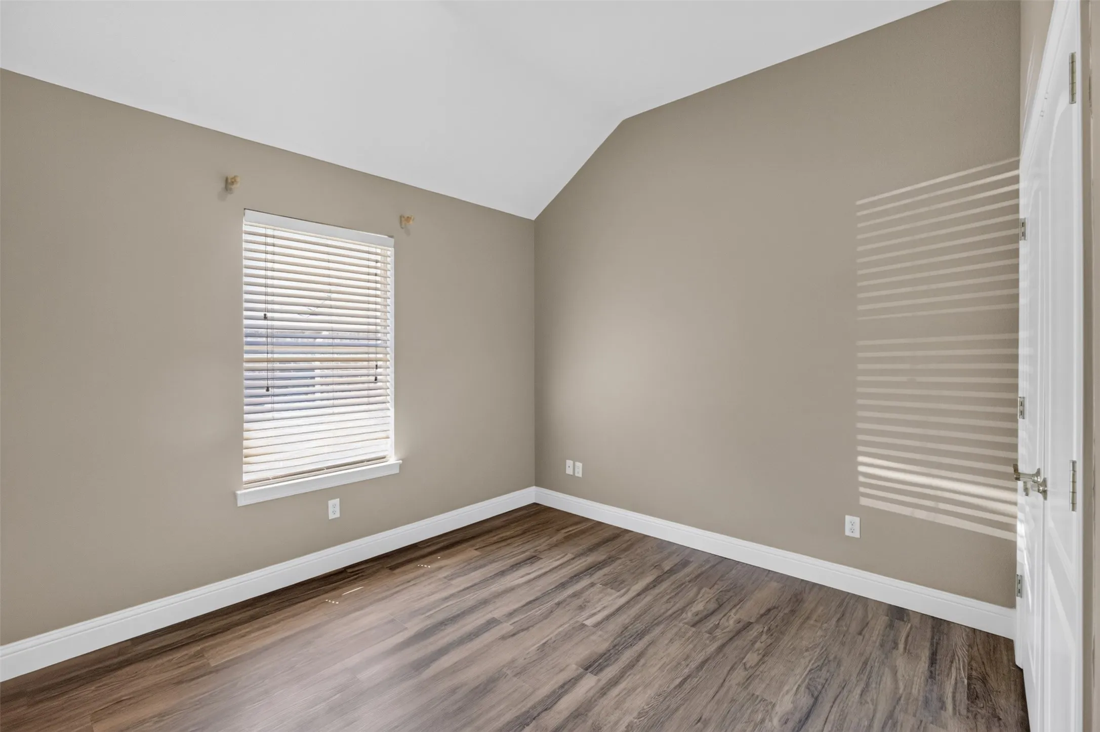 Well-lit bedroom with plenty of wall space!