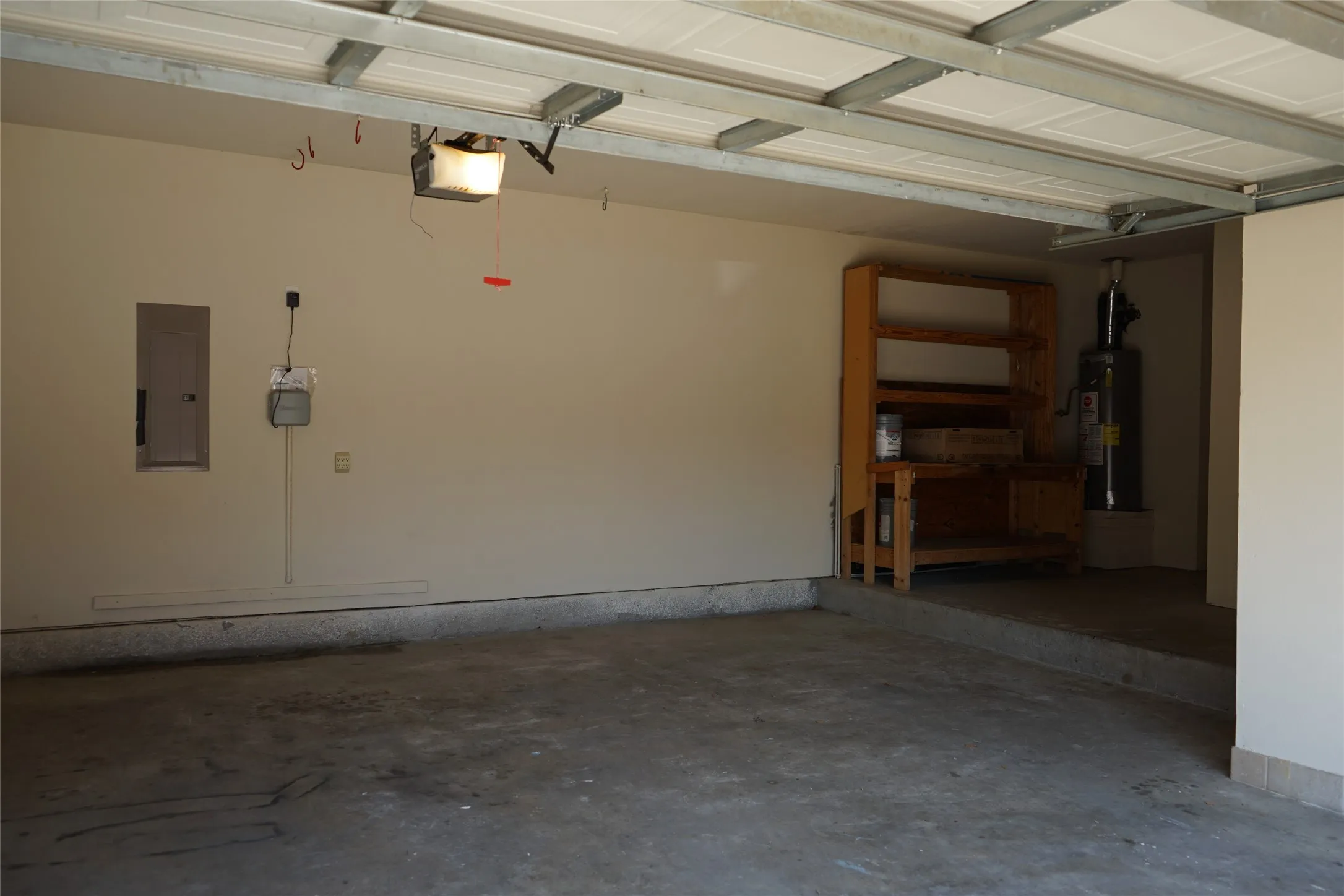 Garage with extra storage space and workbench