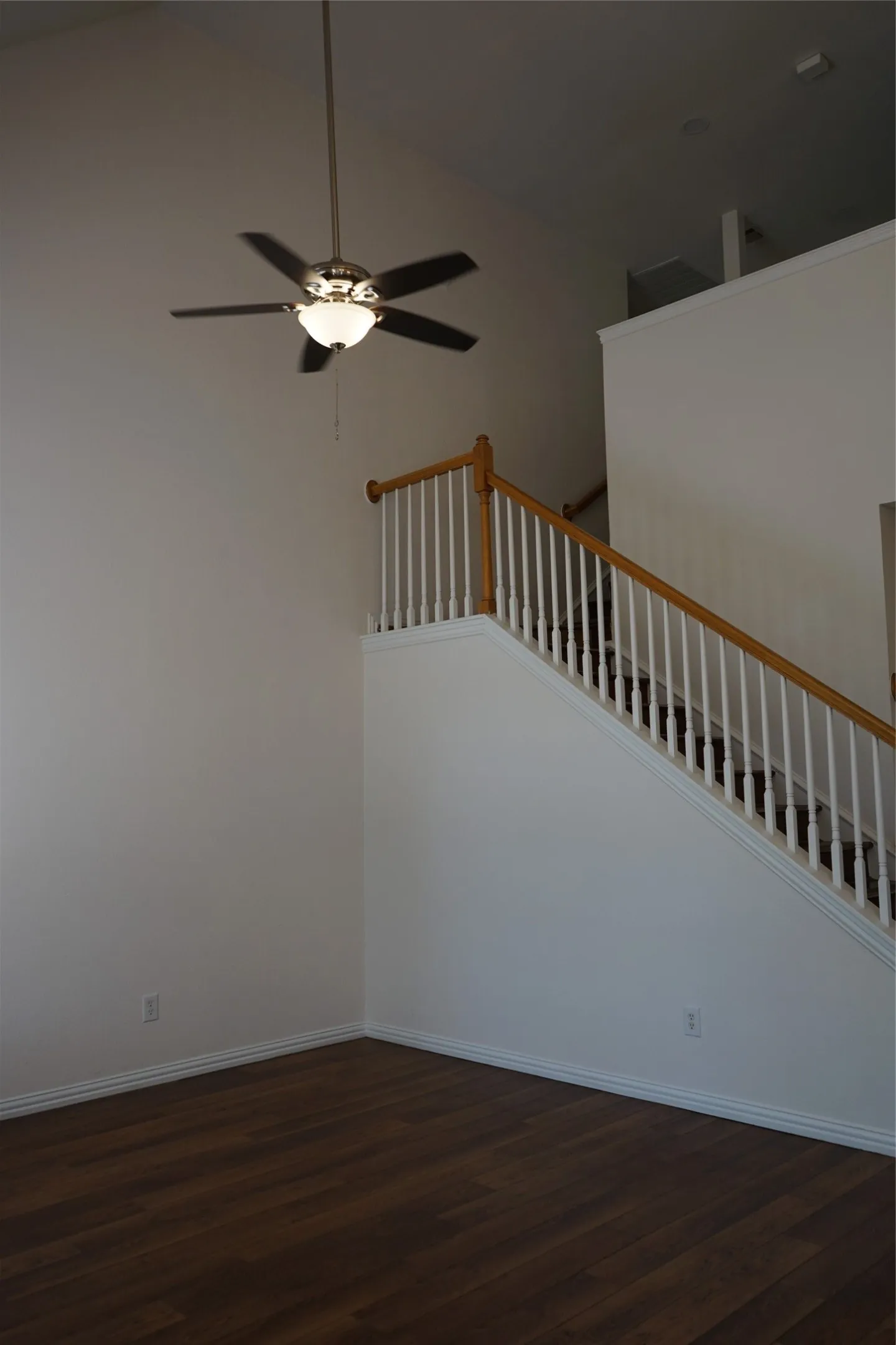 Stairs leading to workspace landing and second floor