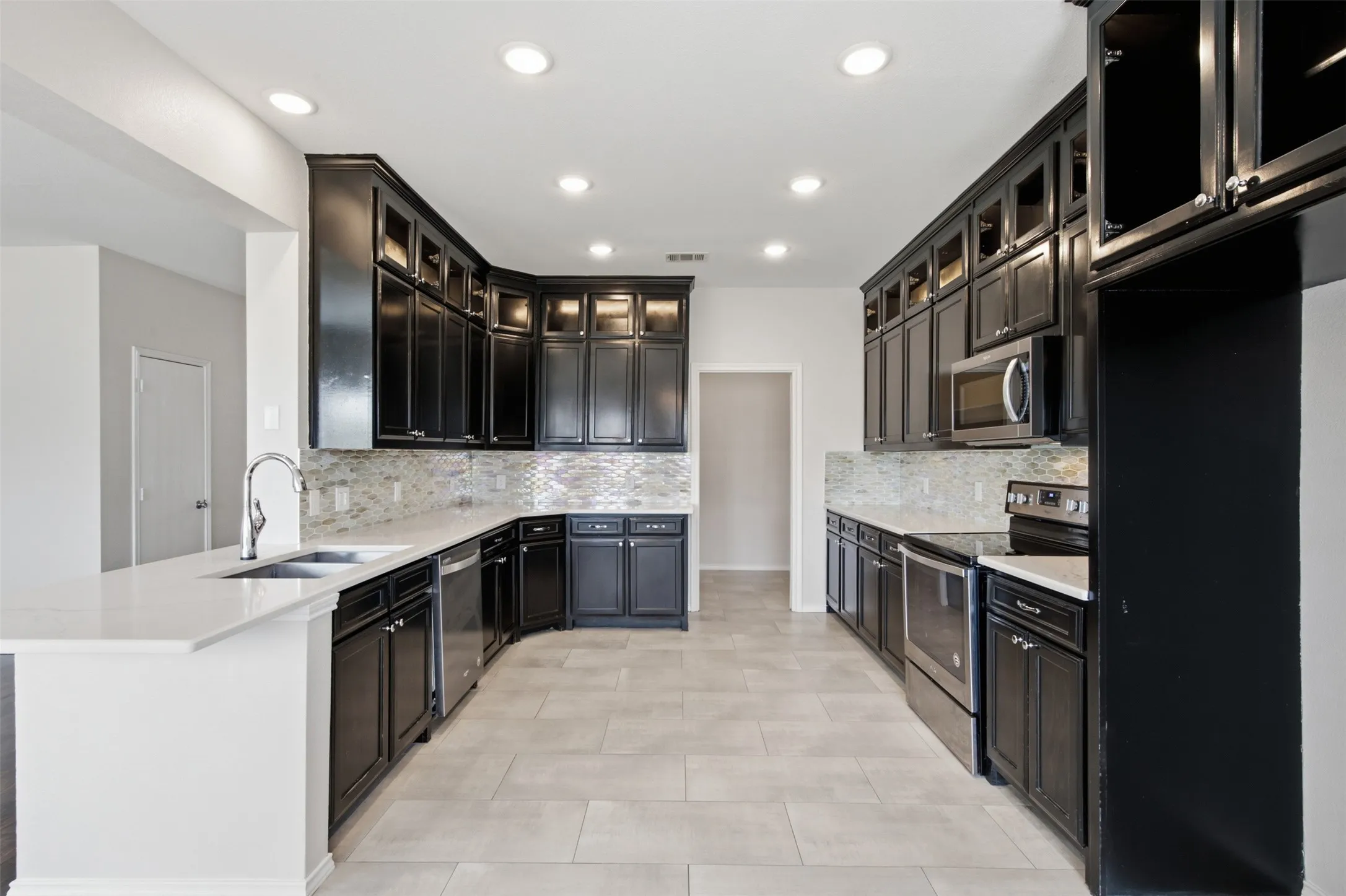 Check Out the new Kitchen Cabinets Recently Installed and the Beautiful New Backsplash!