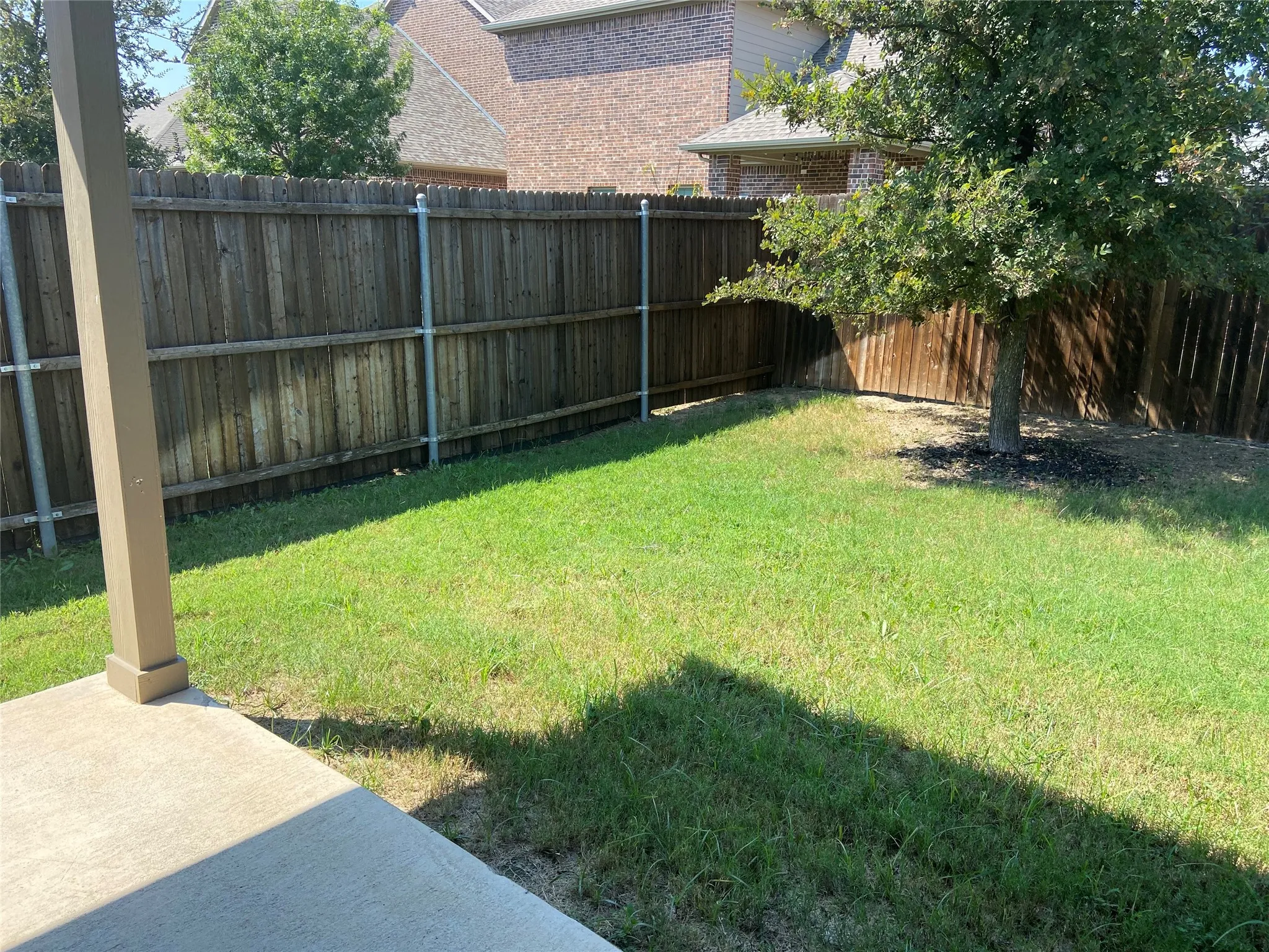View of fenced backyard