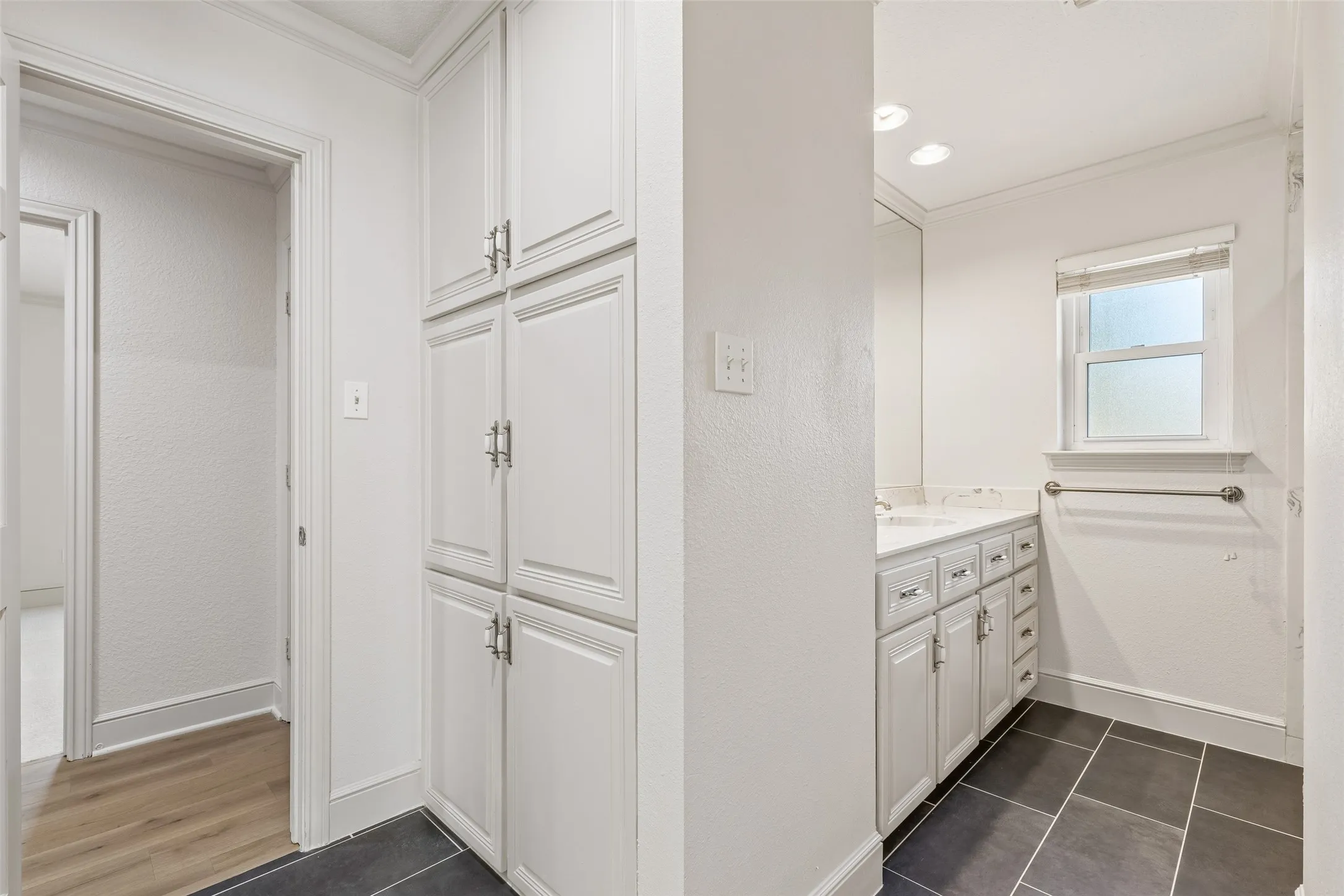 White paneled cabinetry with brushed nickel hardware