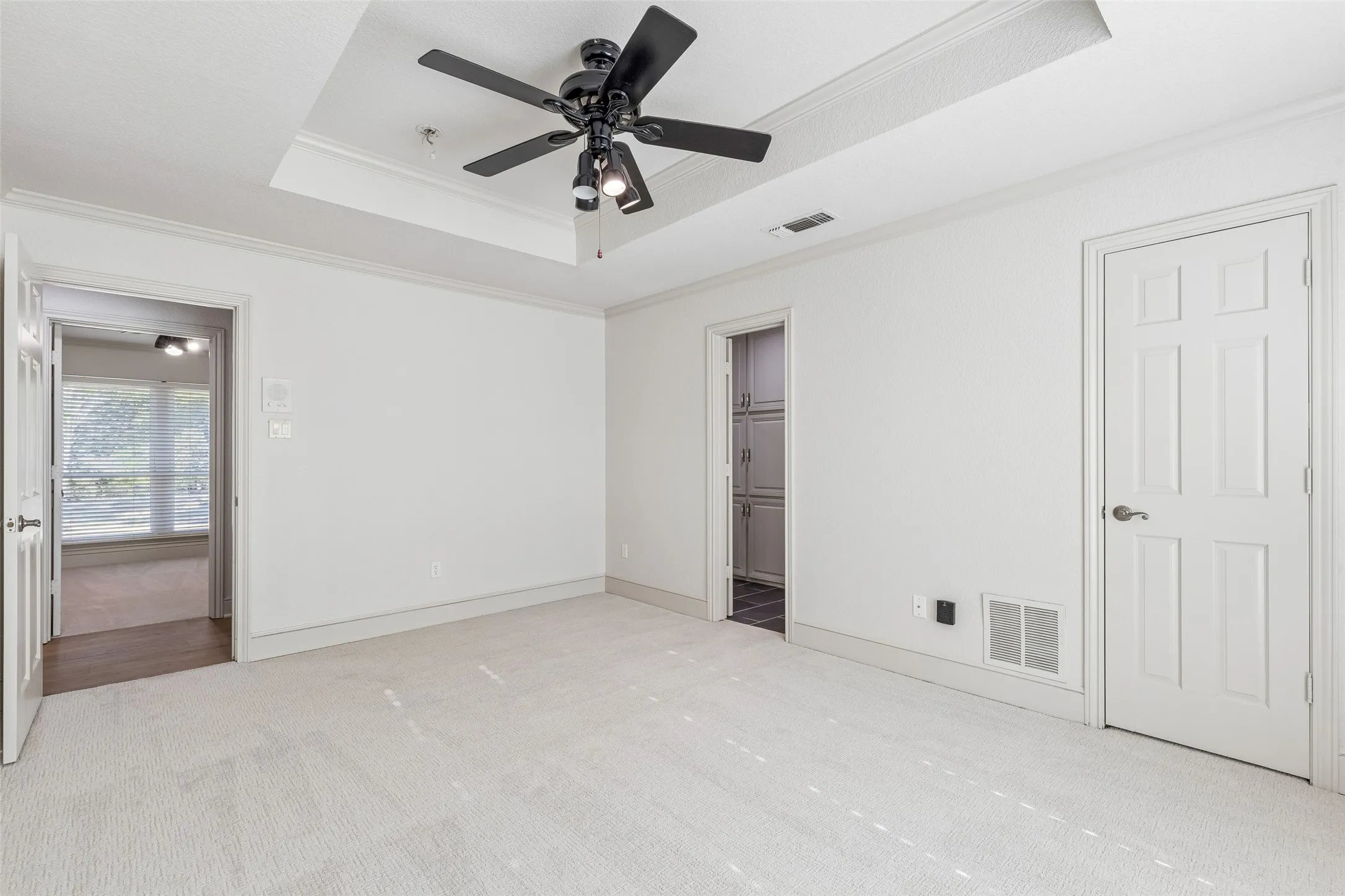 Recessed ceiling with a black ceiling fan