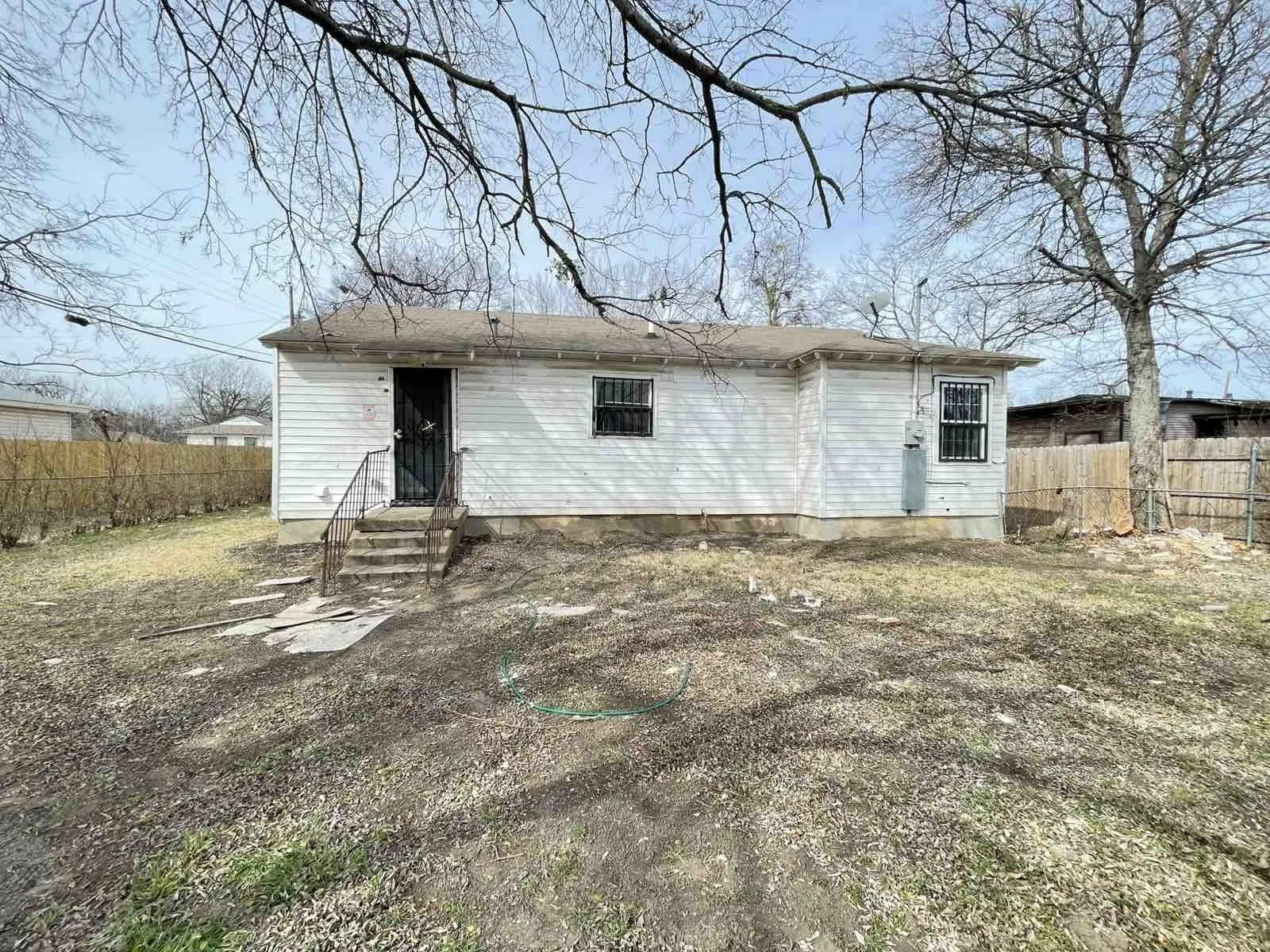 Rear view of property with entry steps